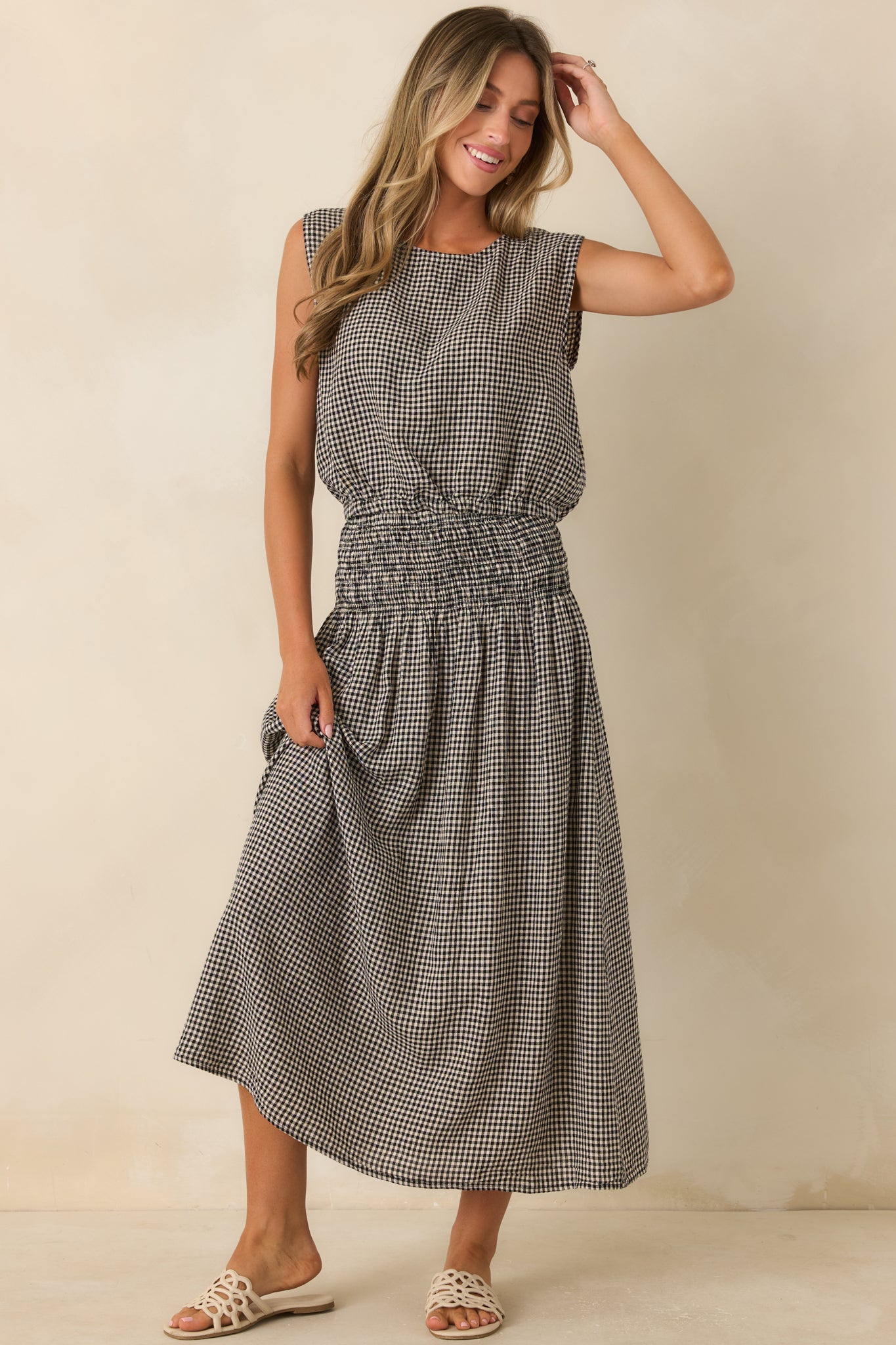 Linen rayon blend top featuring a relaxed fit, round neckline, and softly bloused elastic hem.
