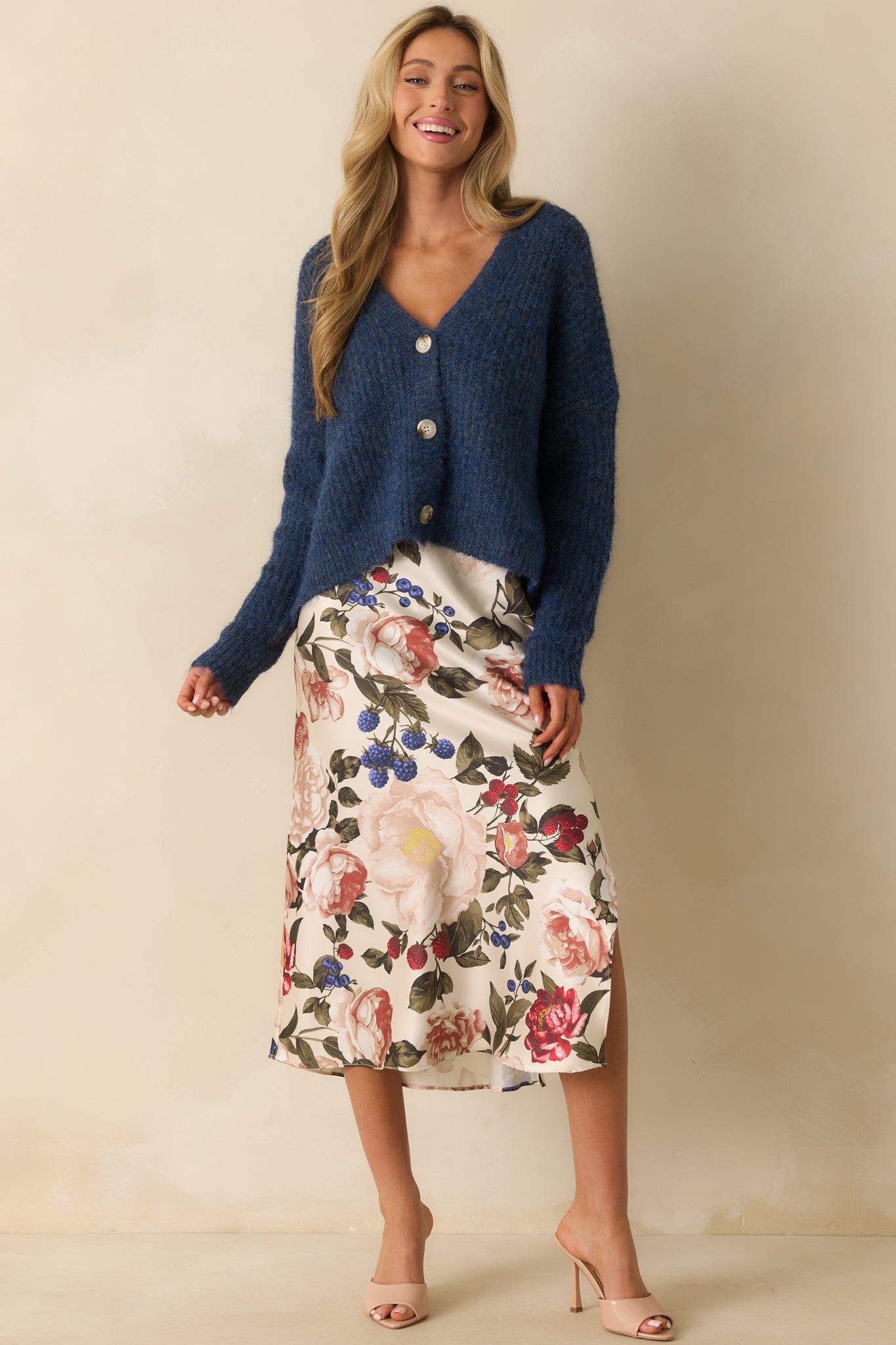 Long-sleeve navy cardigan featuring a functional tortoise shell button front.