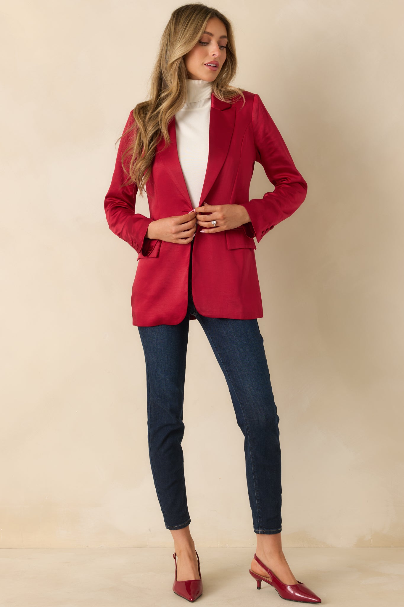 Long-sleeve blazer in smooth satin-like fabric with faux front flap pockets.