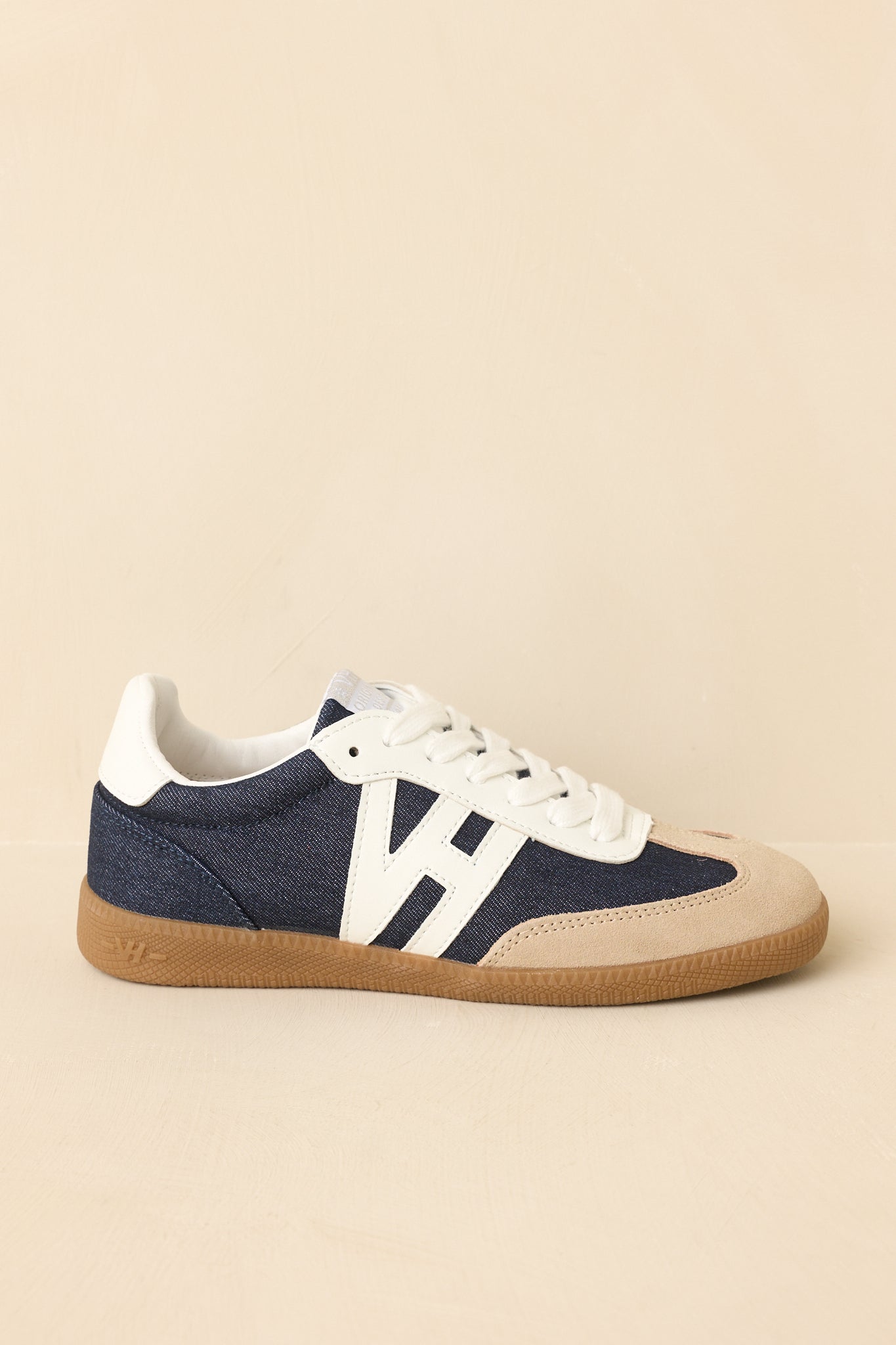 Low-angle view highlighting traction outsole and layered material details.