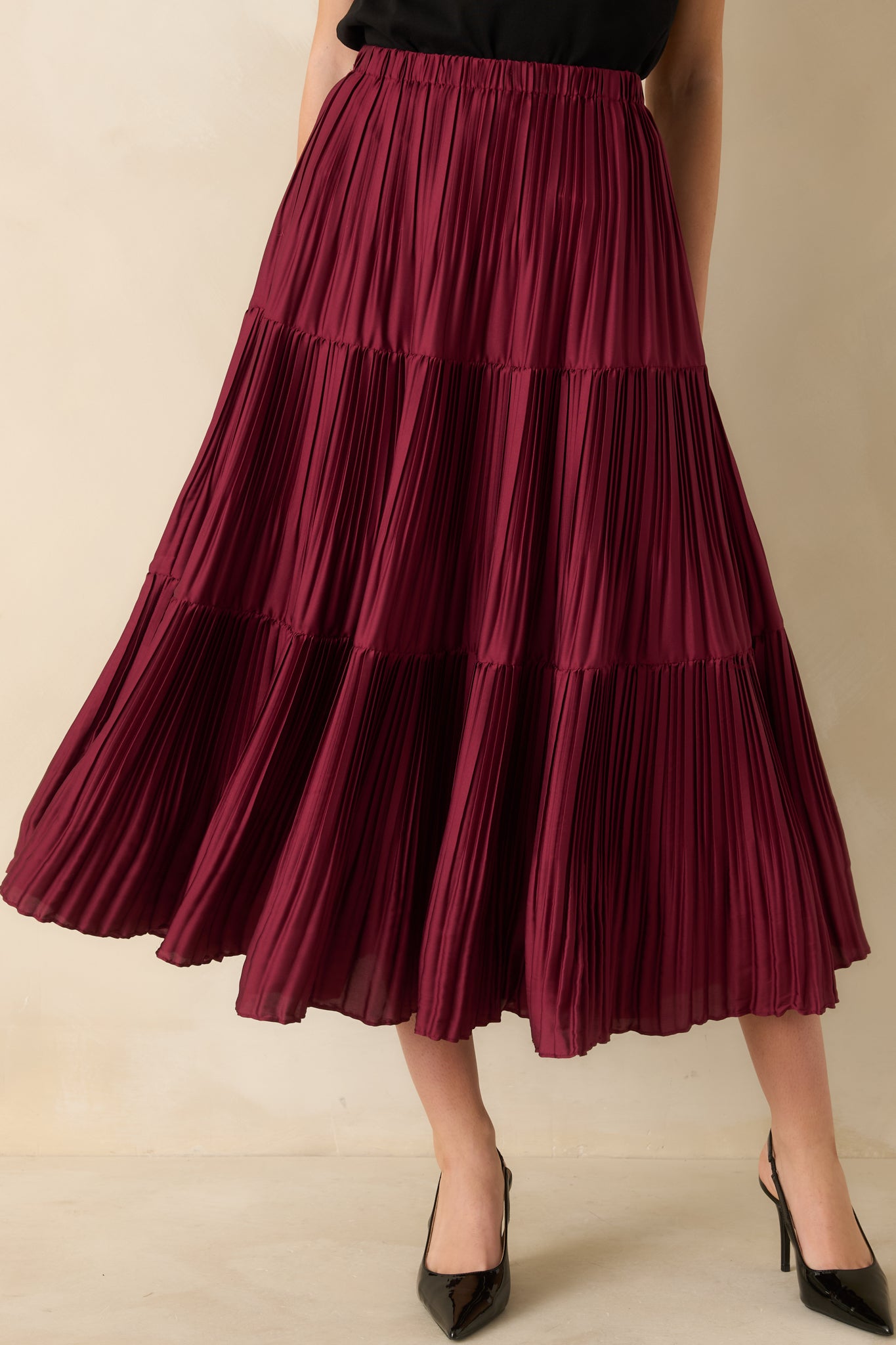 Lower-half crop highlighting the flared silhouette and textured tiers of the skirt.