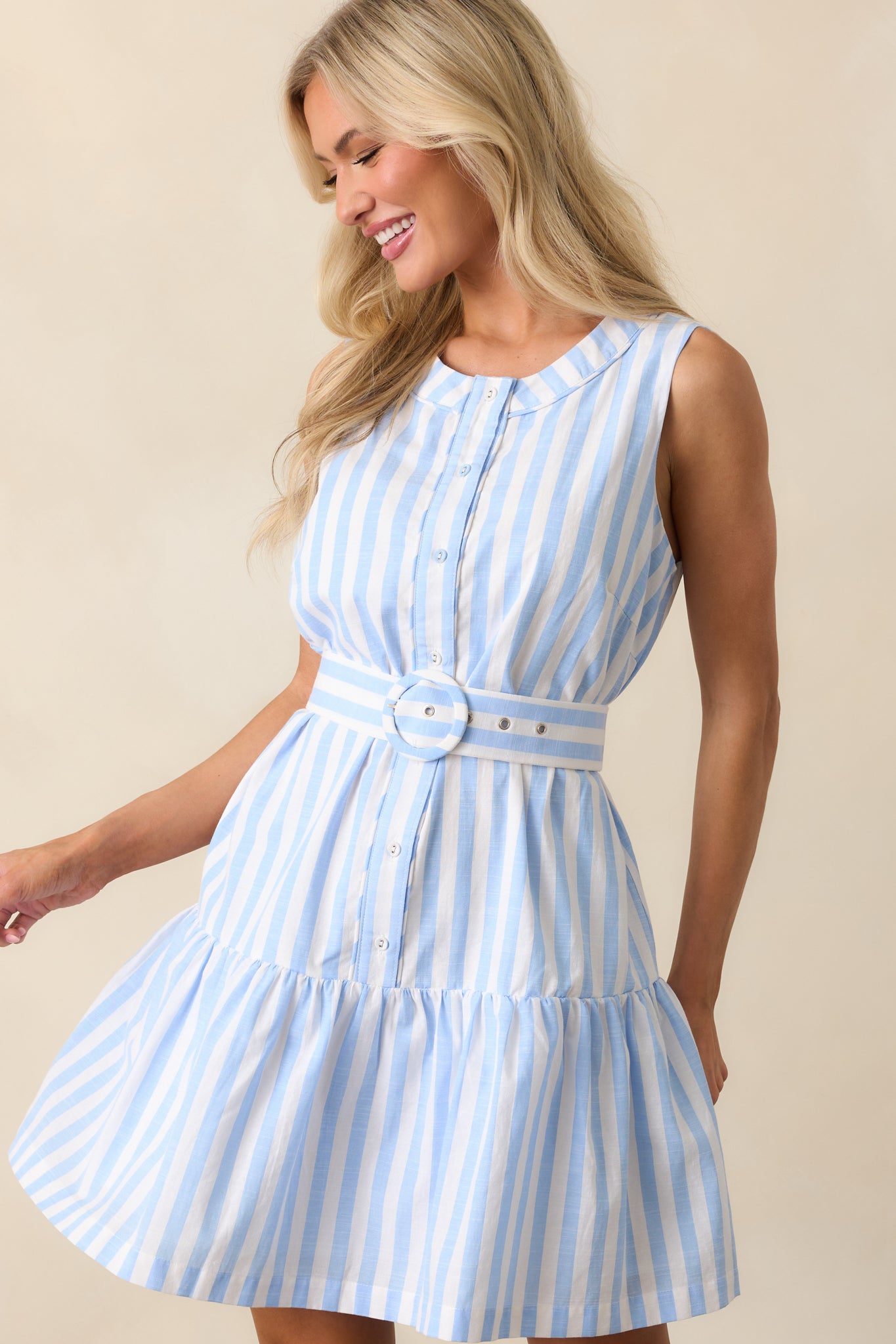 Lower section of the light blue mini dress highlighting the tiered skirt and hemline.
