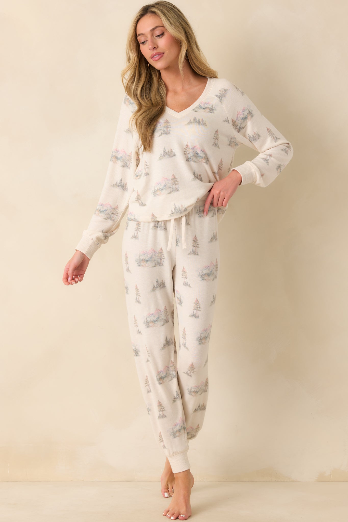 A front-facing shot highlighting the camp-inspired print and V-neckline on the ivory fabric.