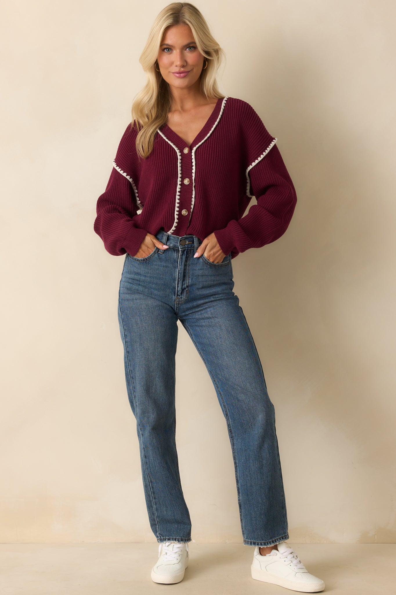 Maroon ribbed knit cardigan with a v-neckline and functional button front closure.