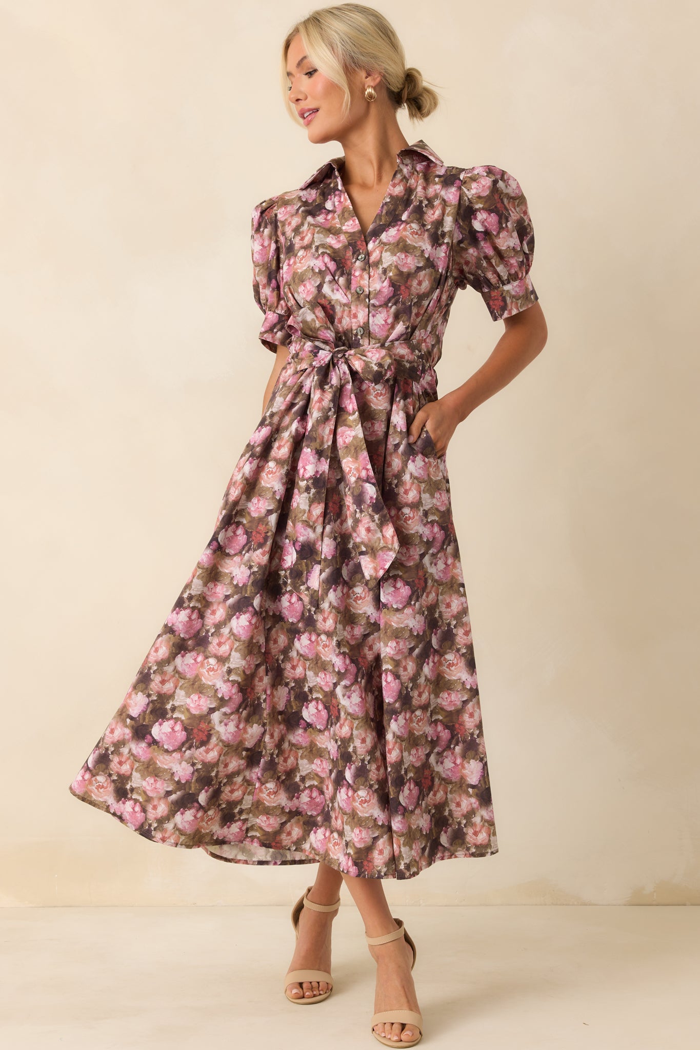Front-facing angle of the mauve dress with an adjustable tie waist and pink floral print across the maxi-length skirt.