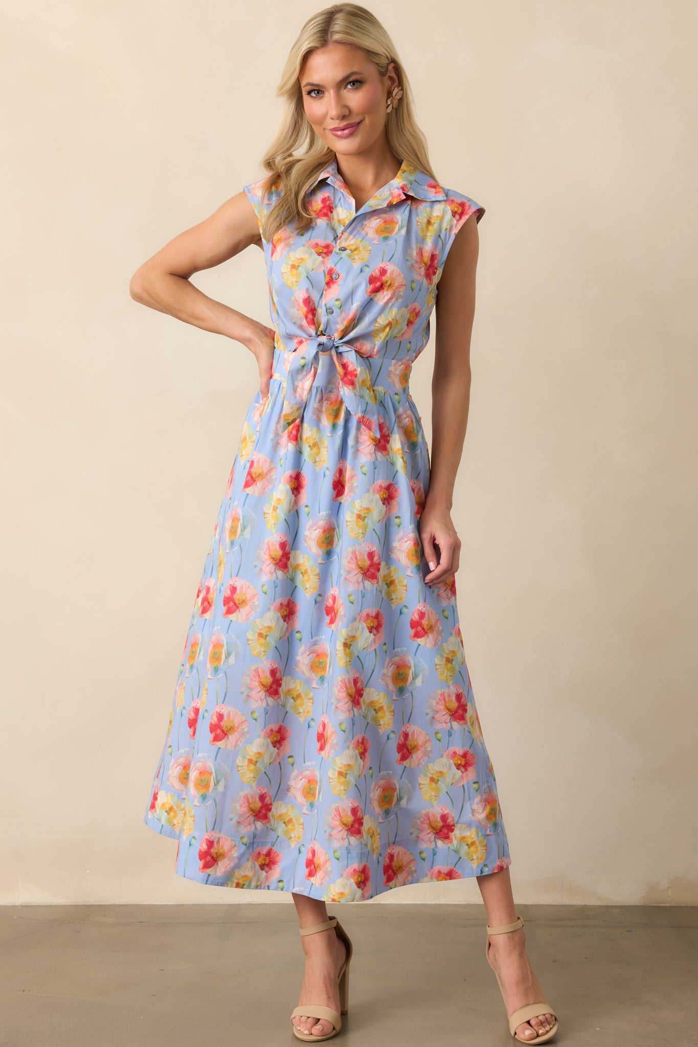 Maxi dress displayed emphasizing the functional pockets and relaxed fit through the skirt.