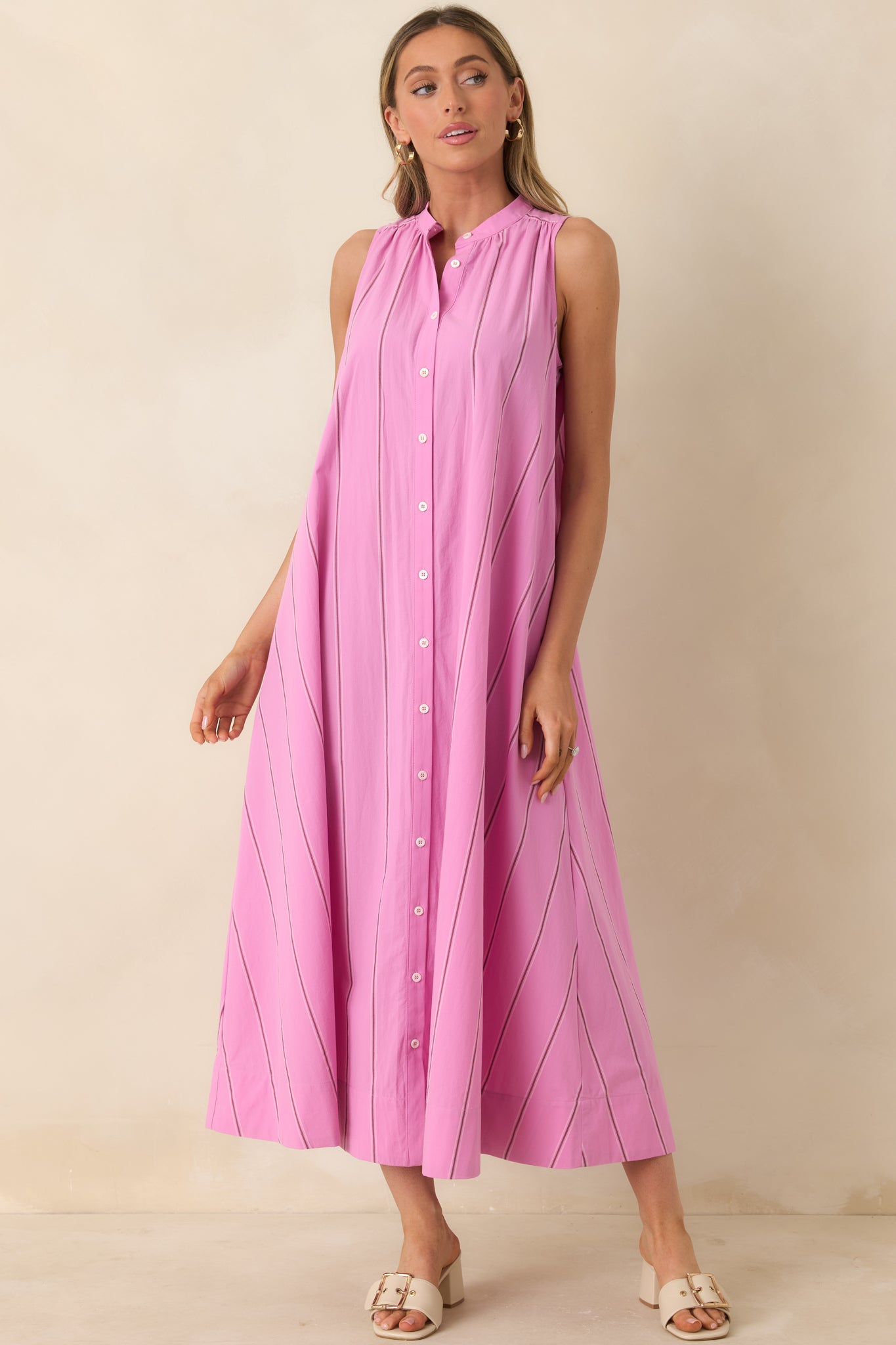 Maxi dress with mother-of-pearl buttons and lightweight, breathable fabric.