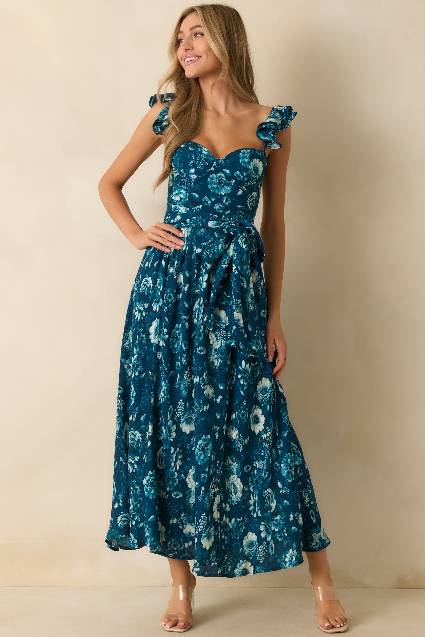 Maxi dress with structured front bodice, sweetheart neckline, and delicate ruffle straps for a feminine silhouette.