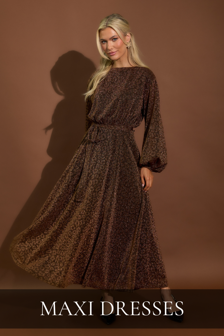 Women’s boutique maxi dresses featuring a long sleeve flowy maxi dress with an elegant silhouette.
