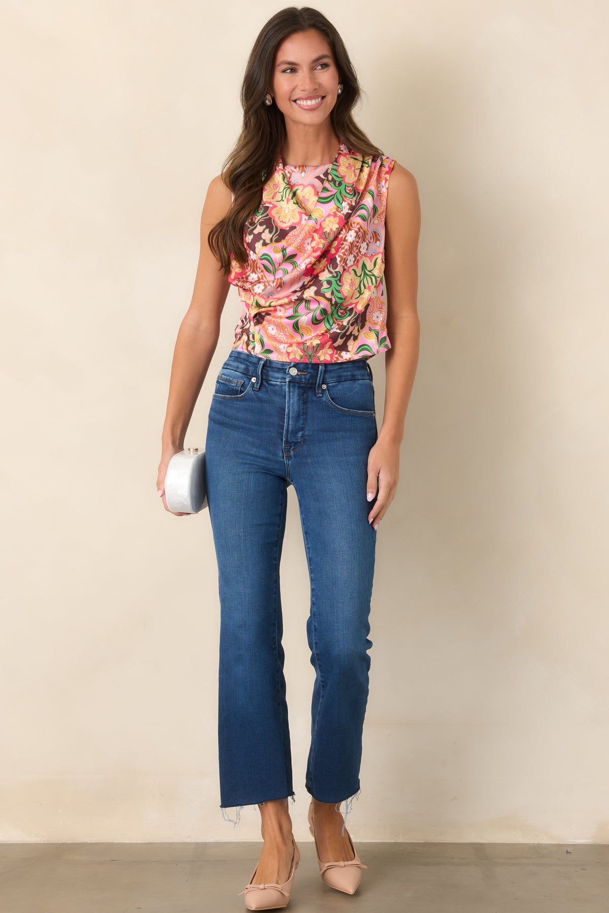 Medium indigo jeans featuring a flattering high rise and slim fit through the hips and thighs.