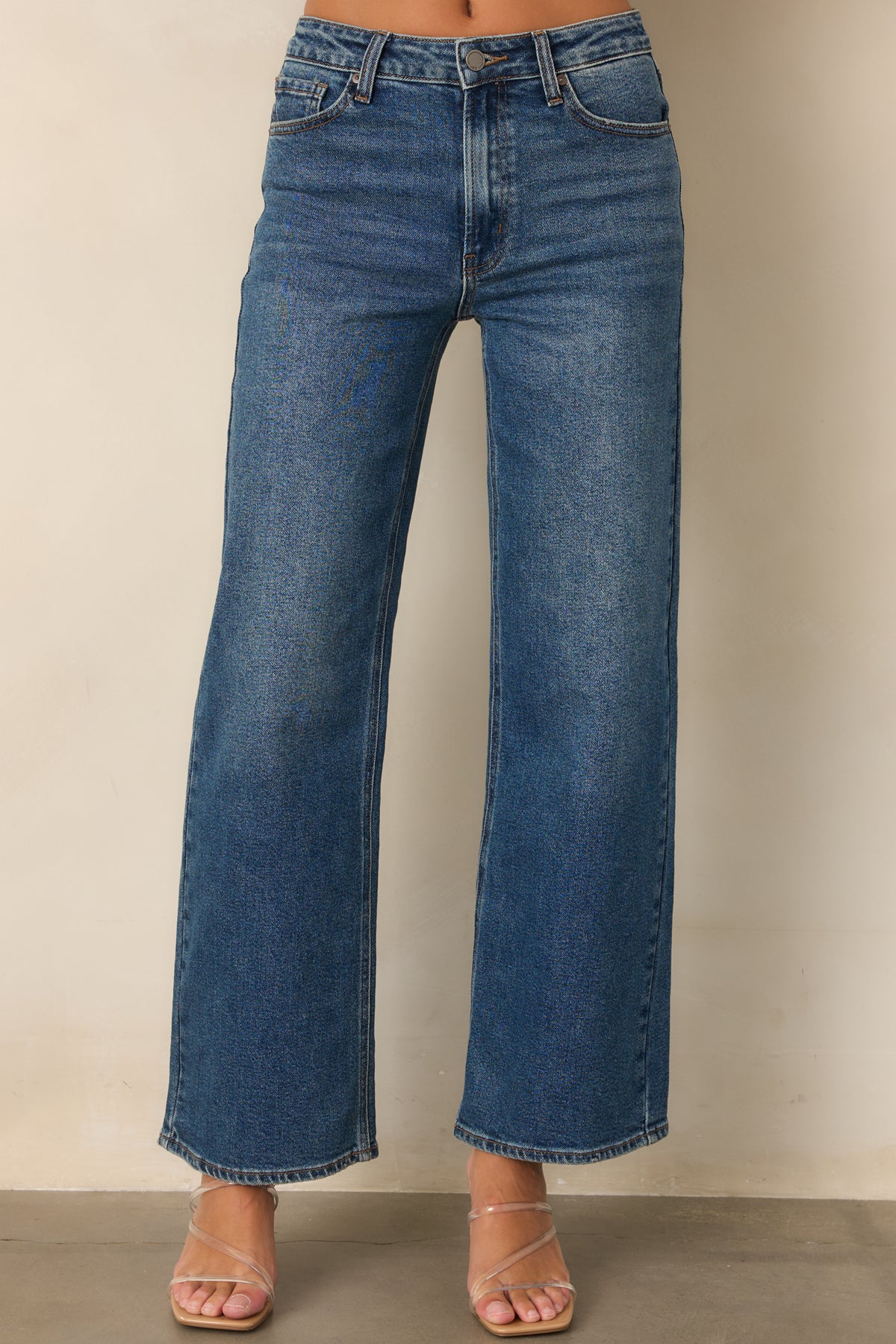 Medium wash jeans with a relaxed straight leg through the ankle.