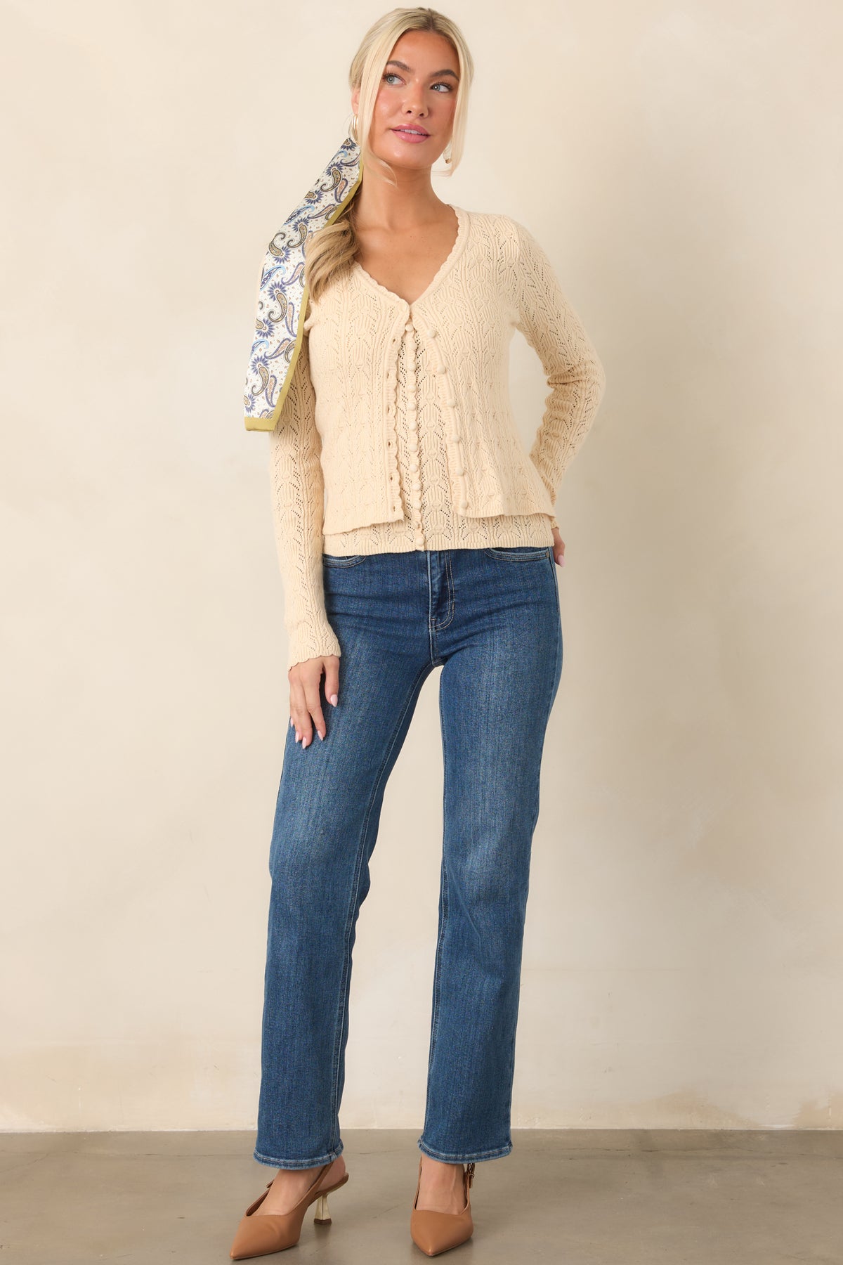 Everyday straight-leg jeans in a medium wash, designed with a high waistband, gentle fading, functional pockets, and a secure button-and-zip closure.