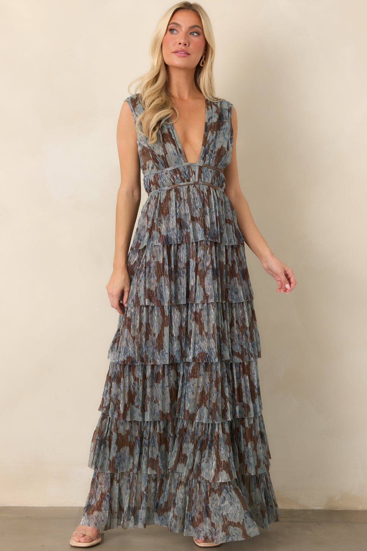 Shimmery metallic floral dress with a wide banded empire waist and flowing floor-length silhouette.
