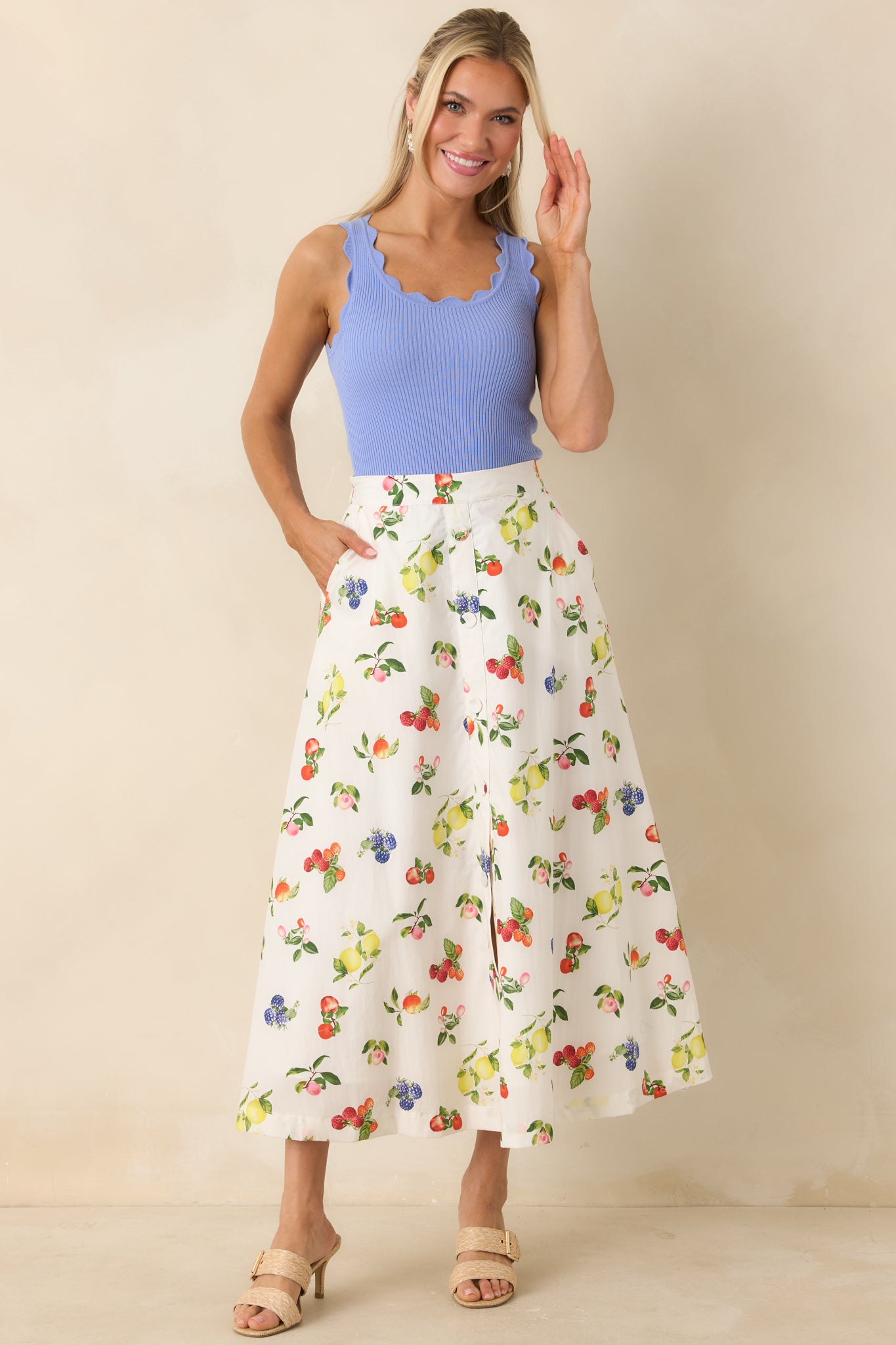 Full front view of midi skirt focusing on pocket detail and playful multicolor print
