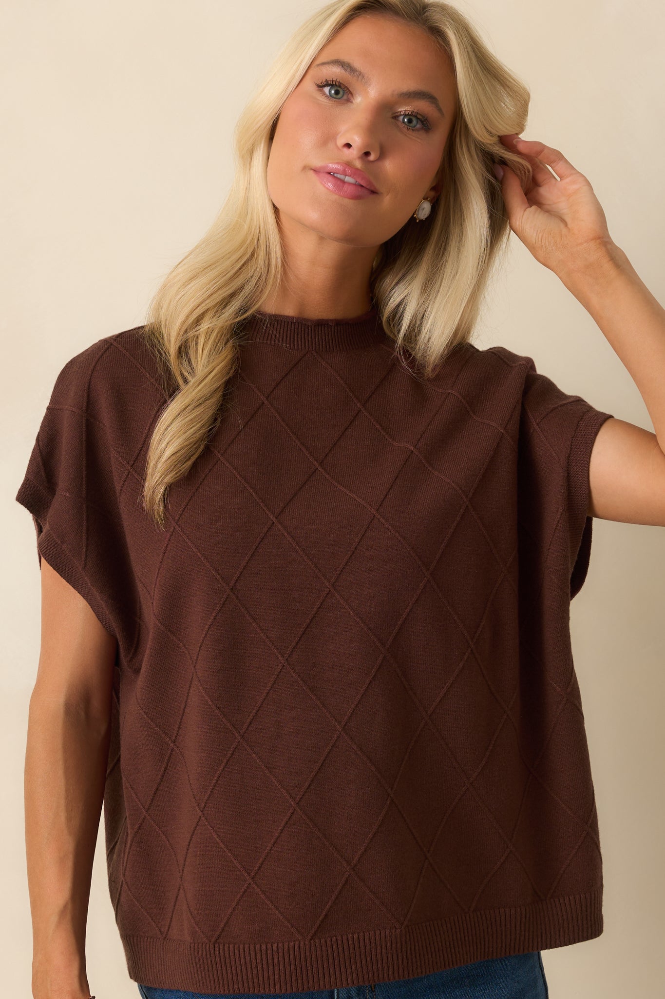 Midsection view highlighting argyle stitch pattern and folded short sleeve cuffs.