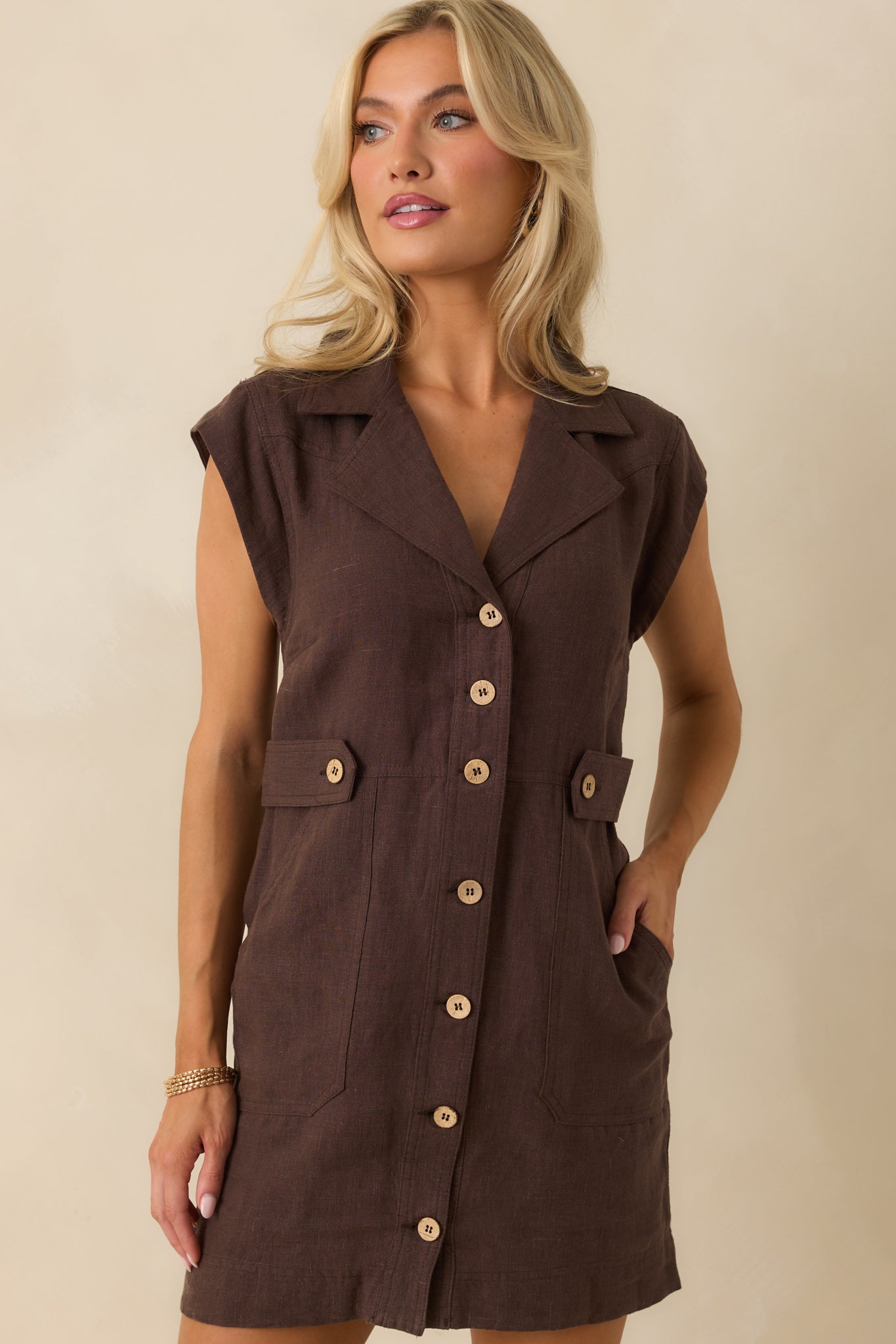 Midsection view showing functional patch pockets and linen fabric texture.