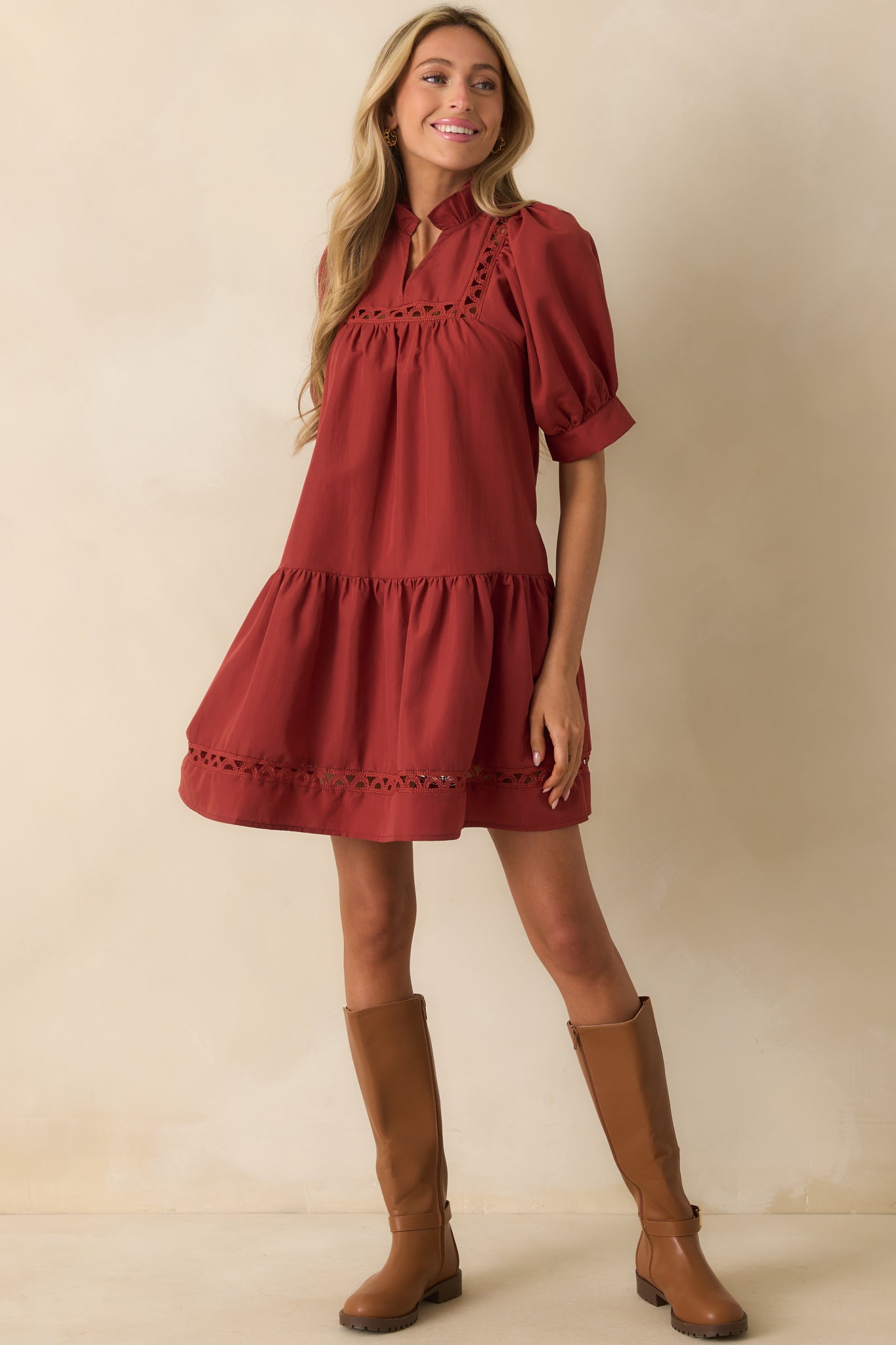 Mini dress with functional pockets and soft ruffle detailing at neckline.