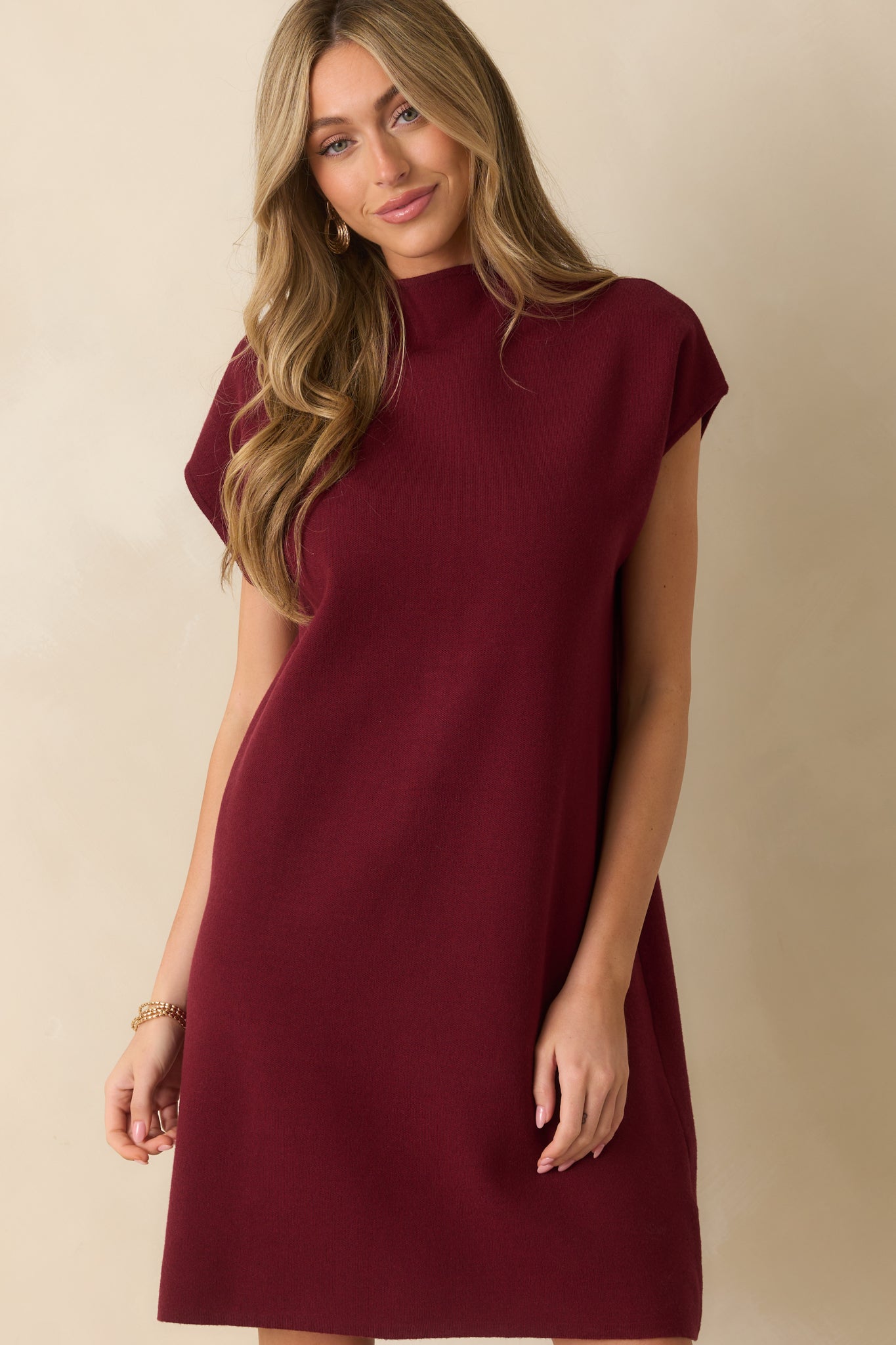 Cropped view of the mini dress’s hem and fabric drape, emphasizing the above-the-knee fit.