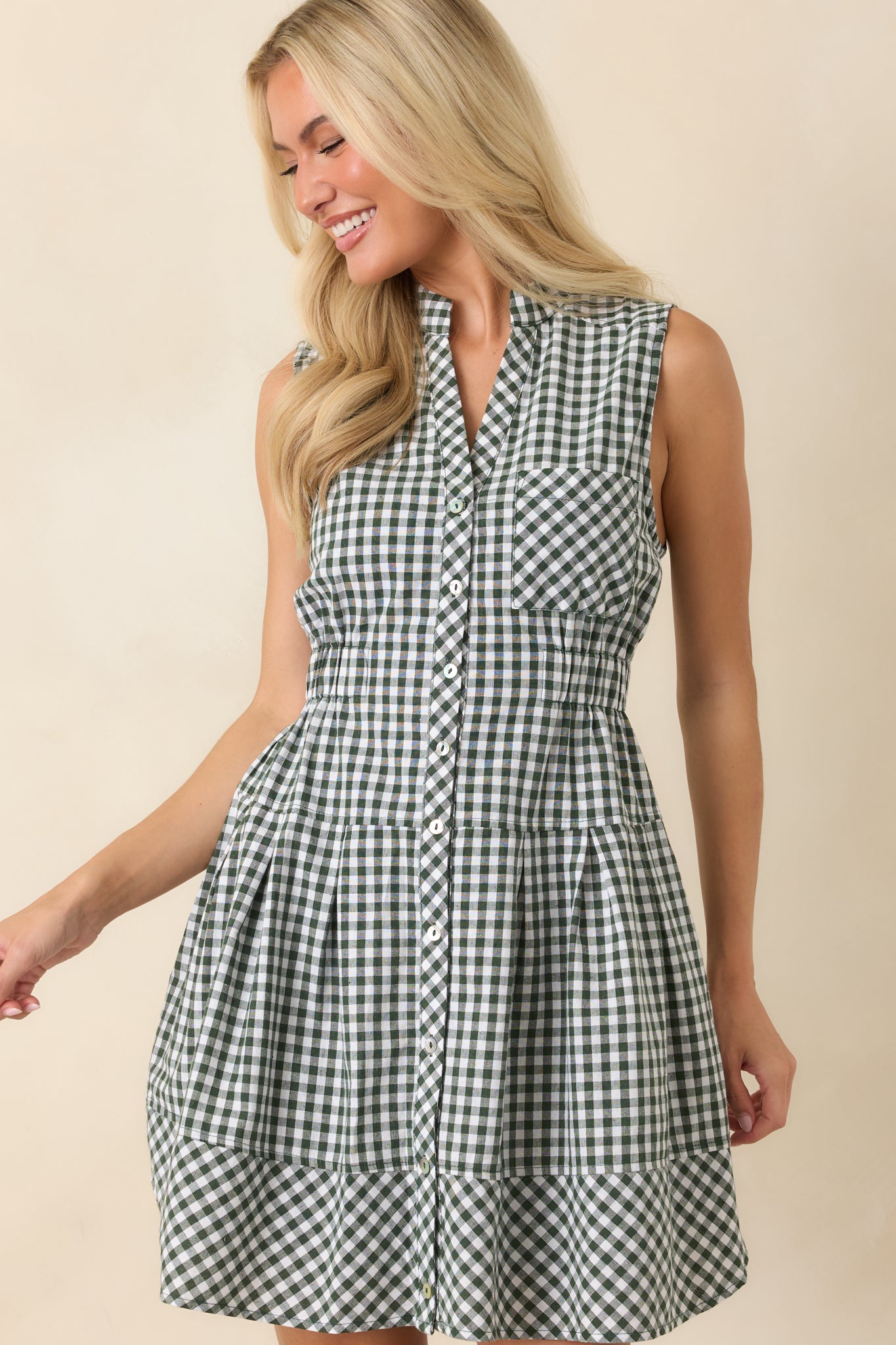 Mini gingham dress featuring the tailored collar, chest pocket, and comfortable relaxed shape.