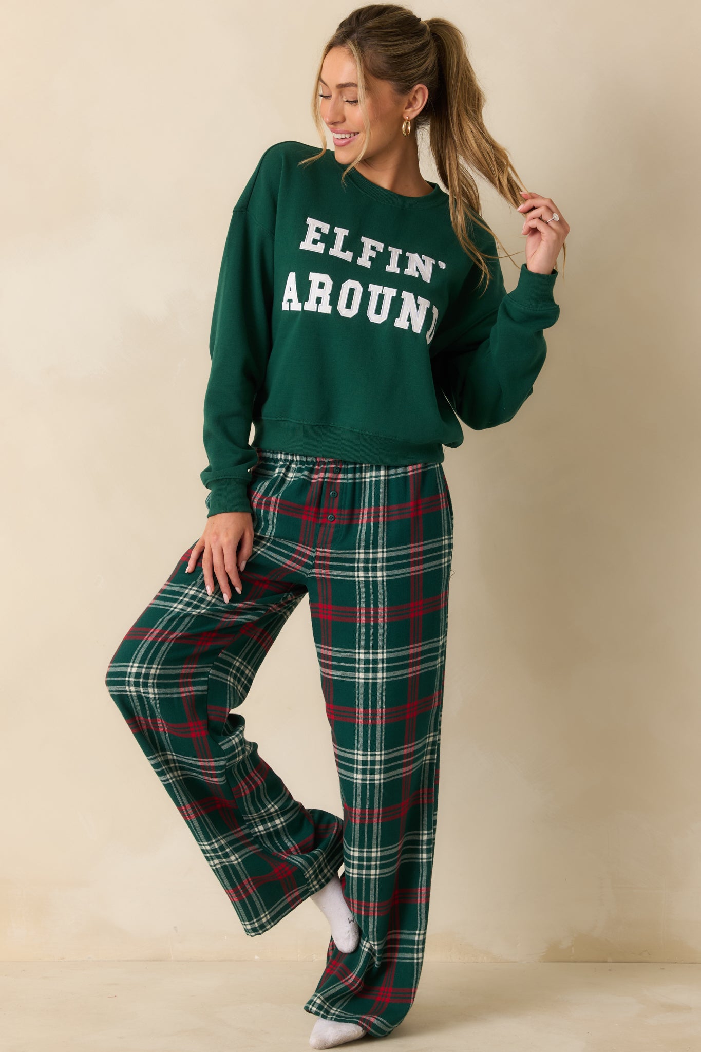 Mistletoe green oversized sweatshirt with relaxed fit and long sleeves, featuring a soft midweight fleece and festive “Elfin’ Around” applique.