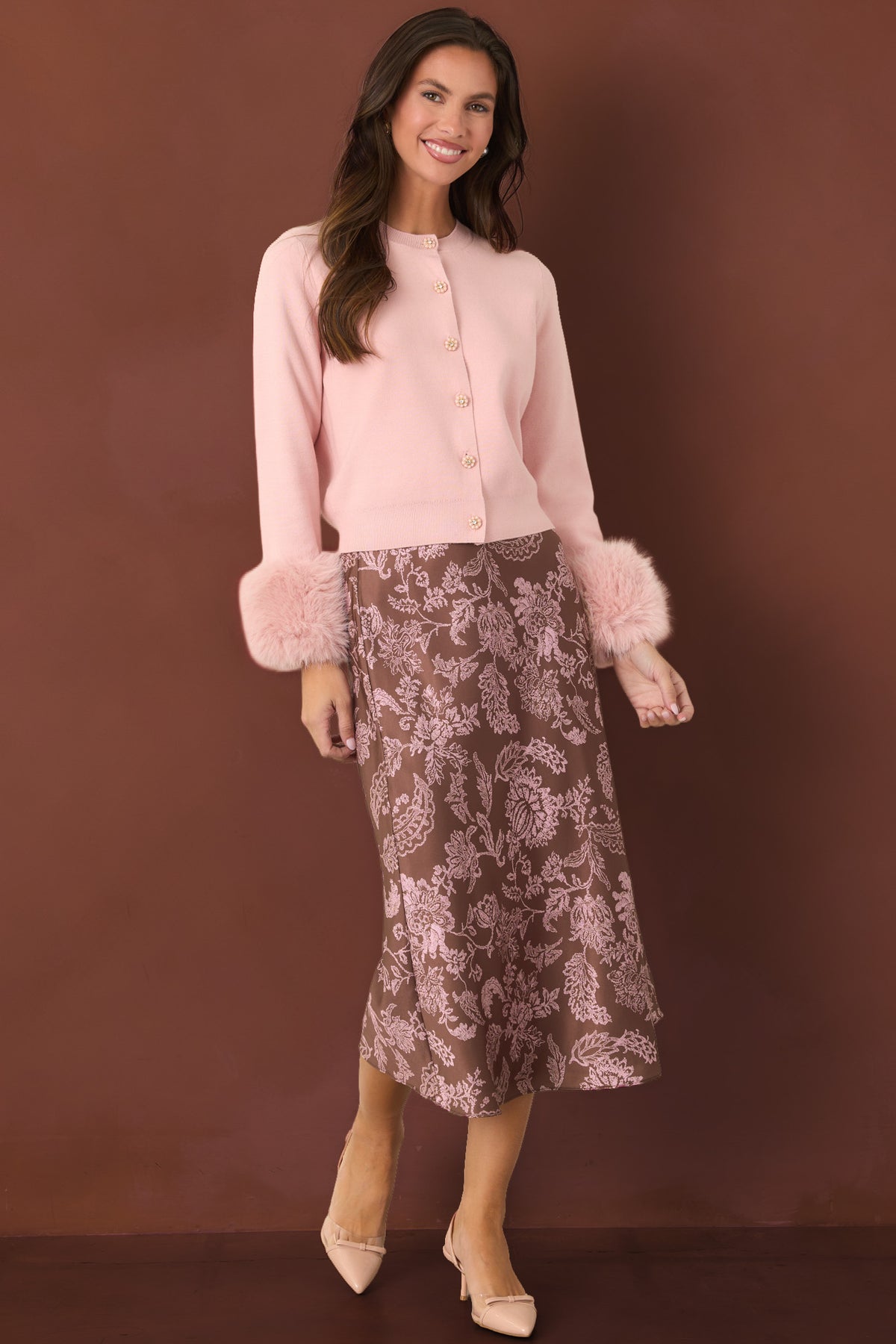 Mocha brown satin midi skirt featuring delicate pink flowers, leafy vines, and scalloped motifs.