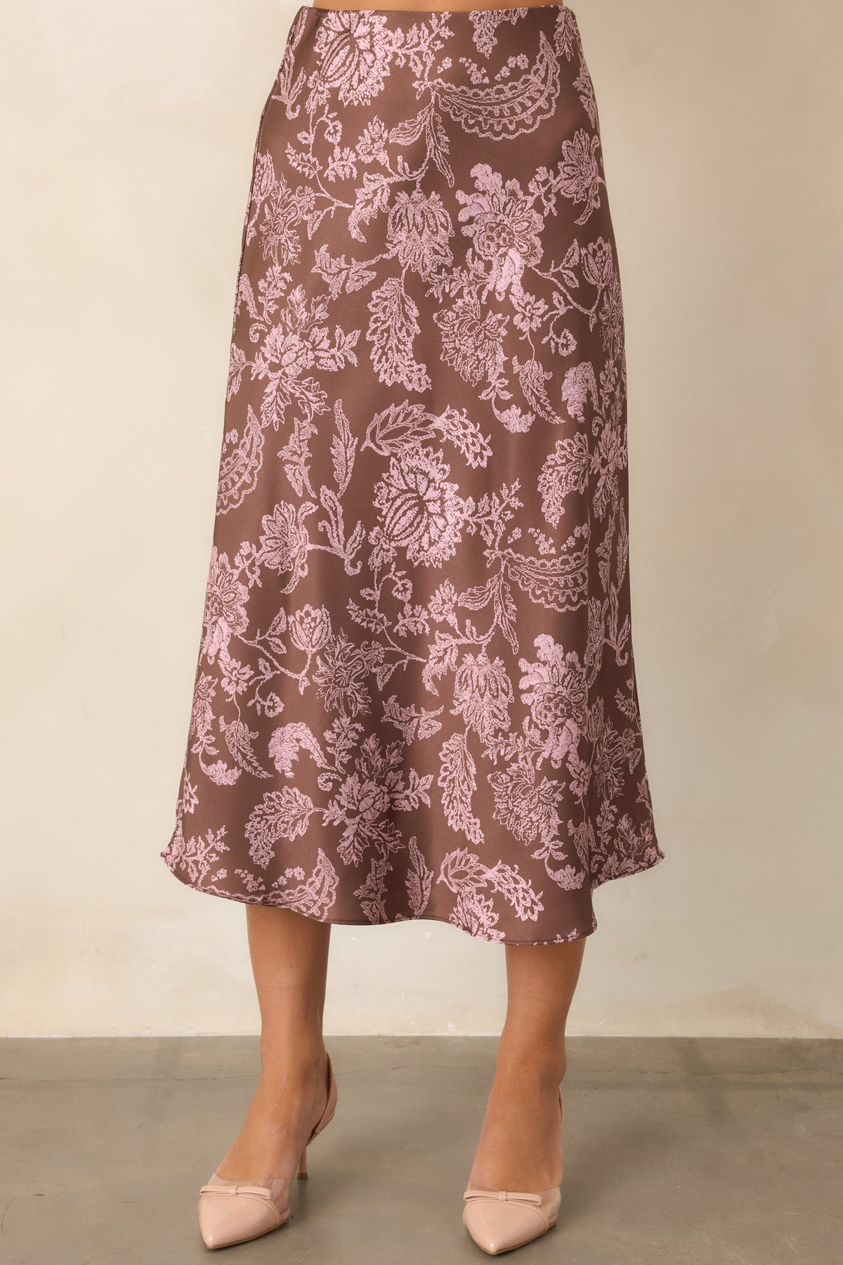 Mocha brown skirt showcasing the smooth satin finish and flowing drape through the hips.