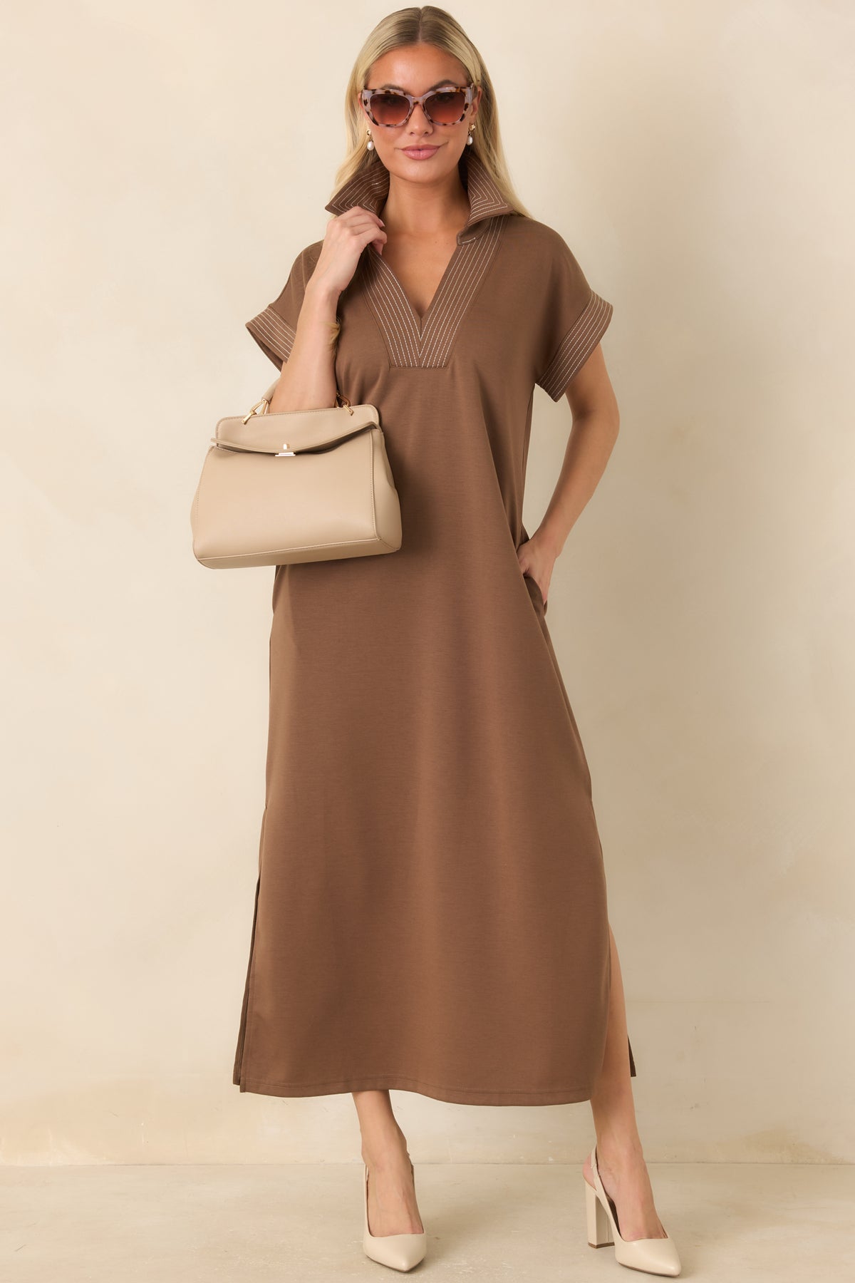 Mocha knit maxi dress with contrast pinstriped trim and a collared V-neckline.