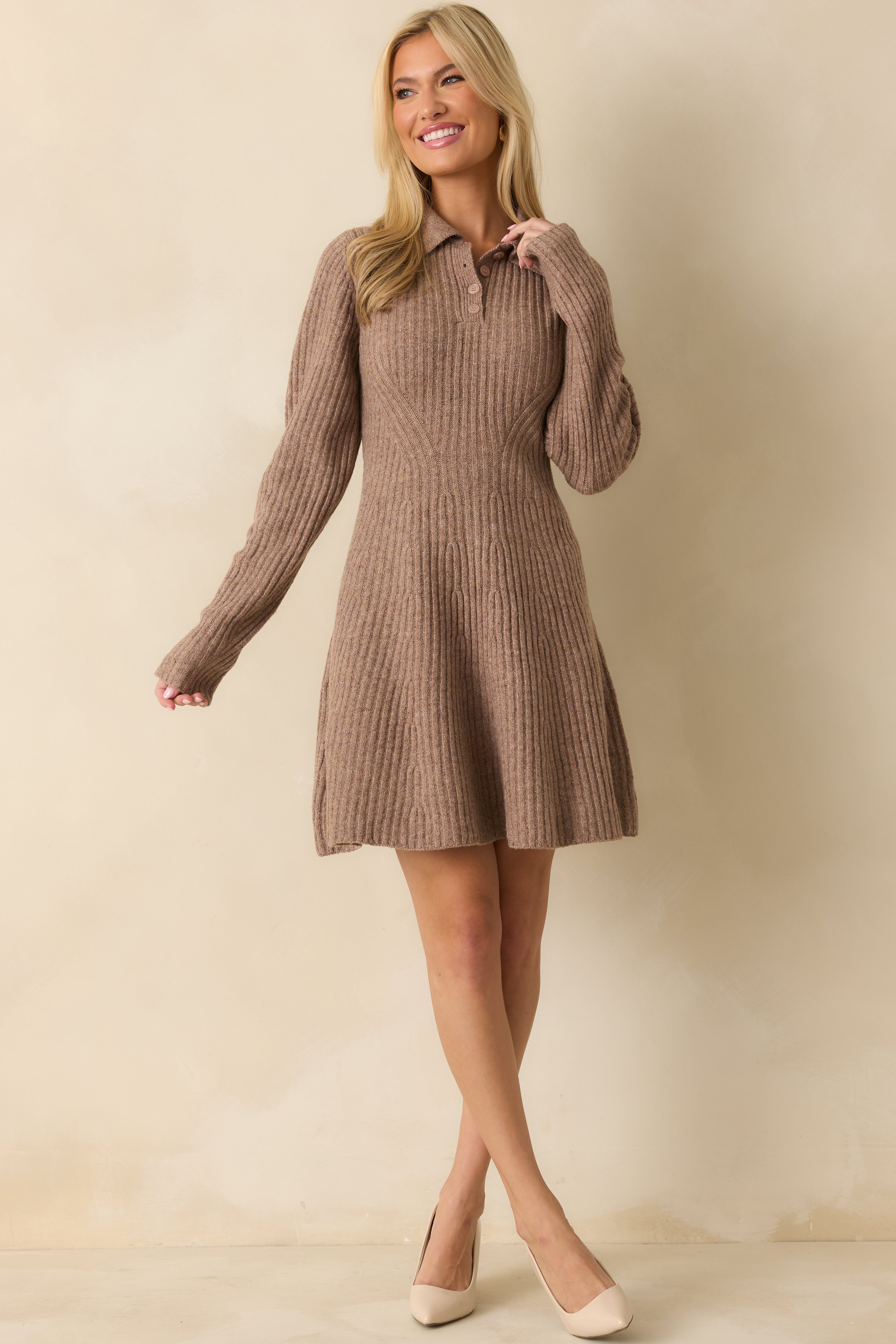 Mocha brown sweater dress with long sleeves, collared neckline, partial button front, fitted bodice, and flared mini-length hem.