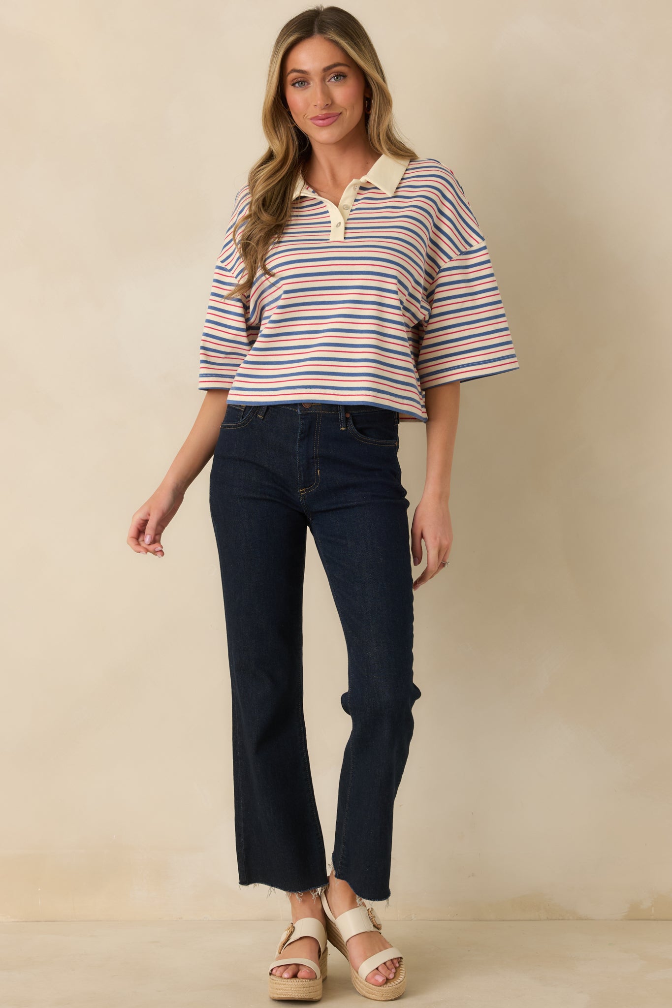 Modern pull-on top in blue multi-stripe with boxy silhouette and short sleeves.