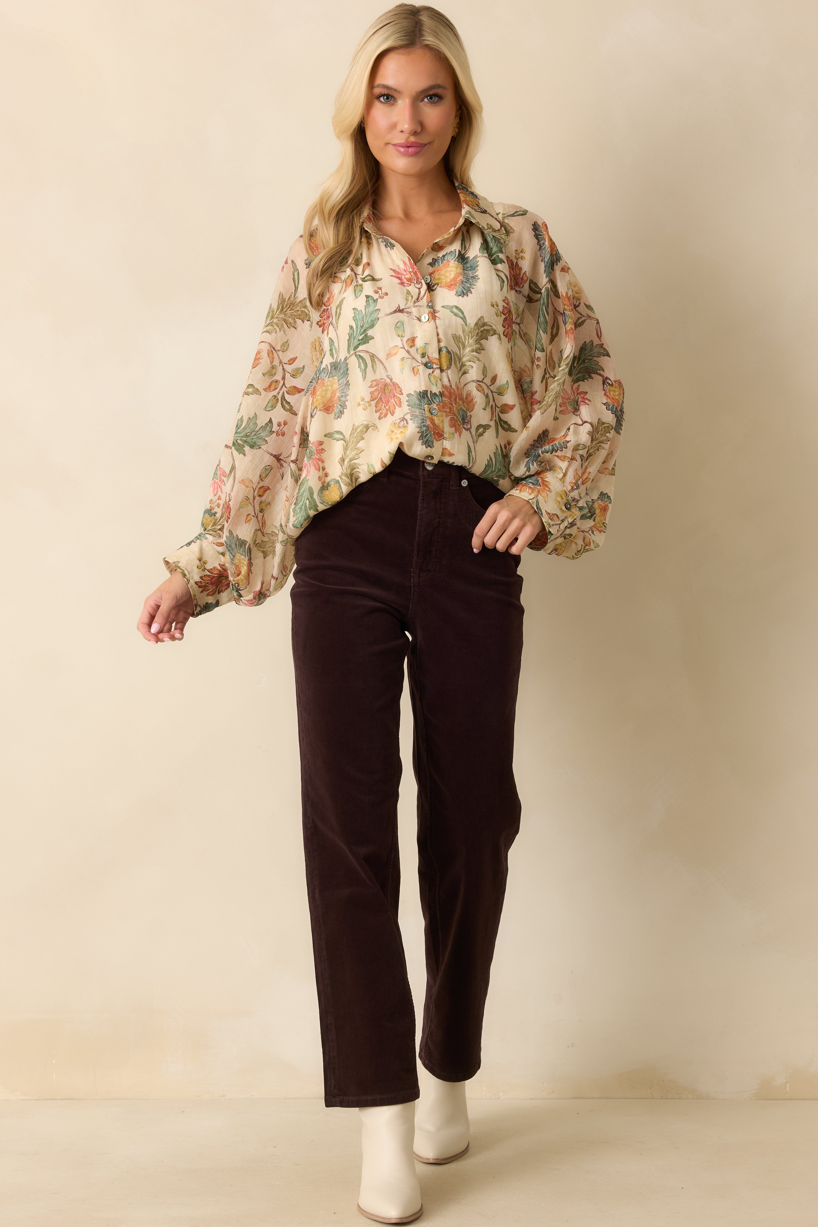 Multi floral blouse with button-front design, long sleeves, and airy relaxed fit.