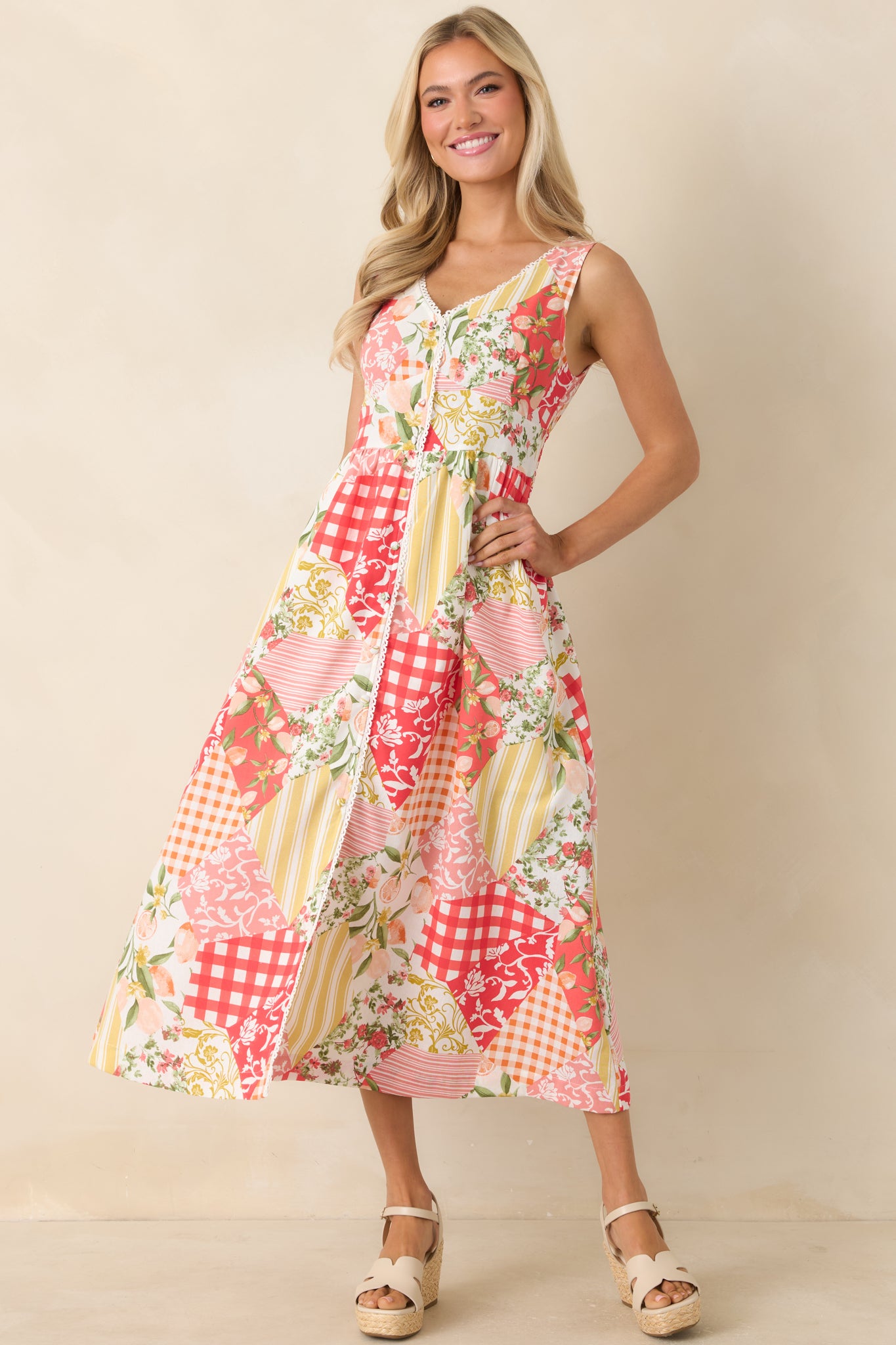Multi patchwork midi dress featuring mixed floral, gingham, and citrus prints with a structured bodice and flowy skirt.