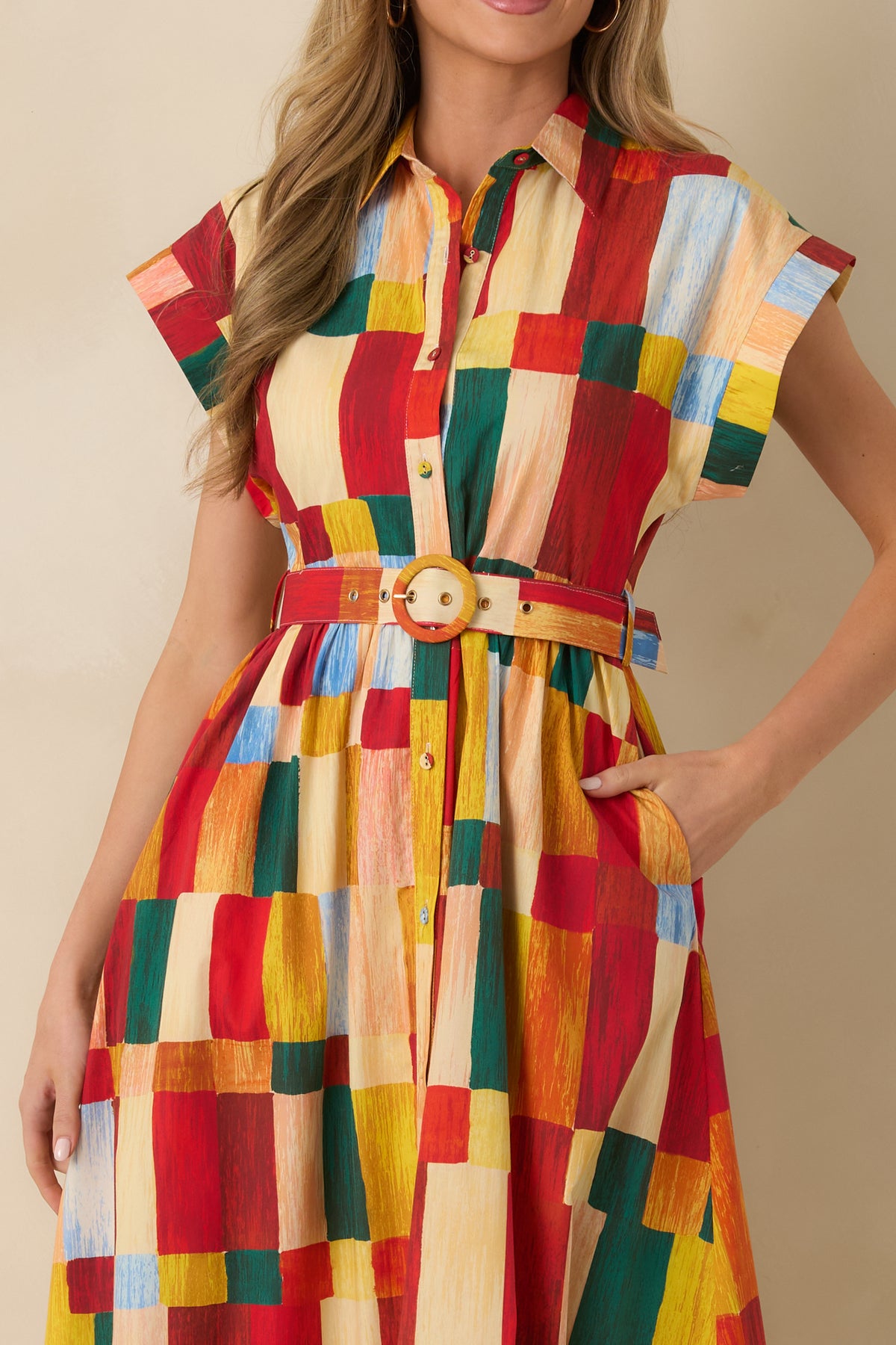 Close-up of multicolor cotton maxi shirt dress featuring a pointed collar, button front, round buckle belt, and side pocket.