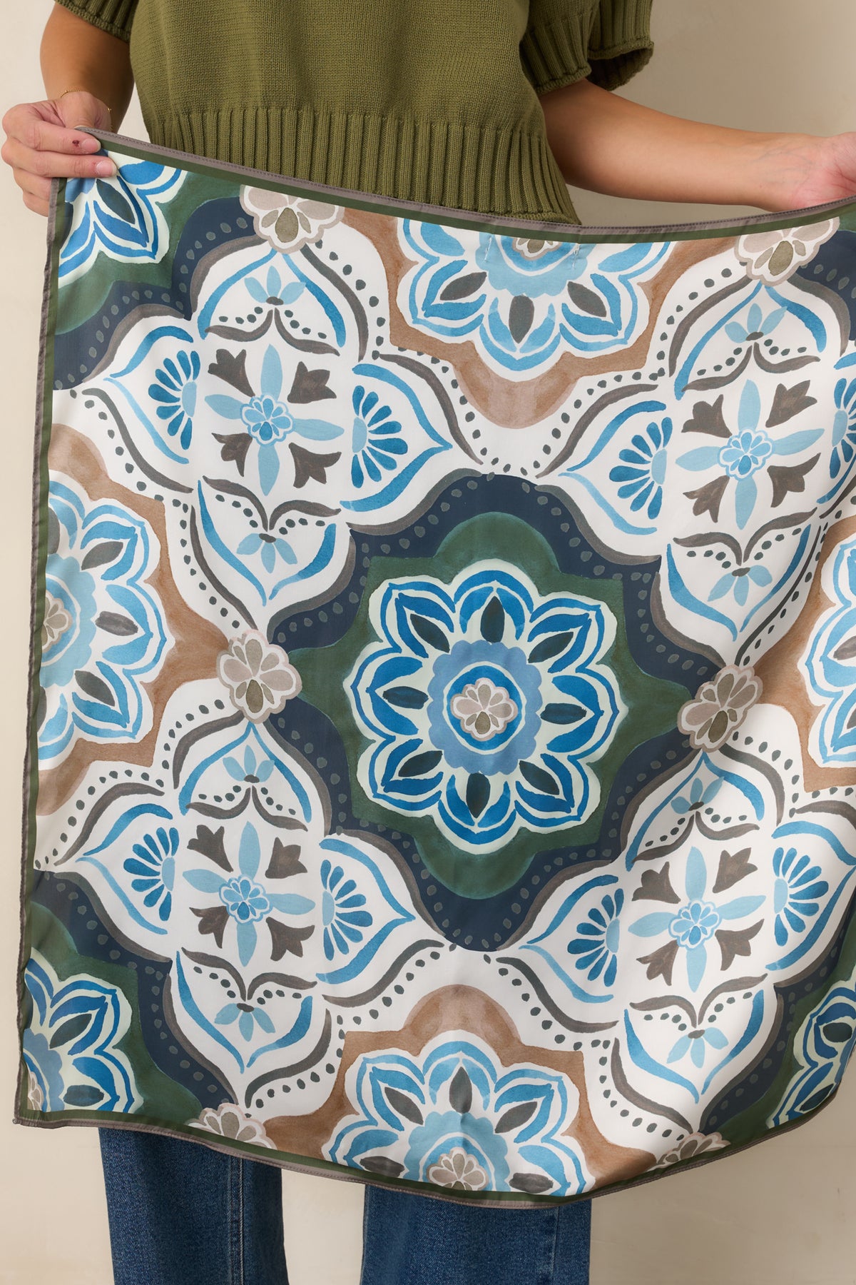 Polished satin scarf displaying an oversized medallion design with rich olive, brown, and blue tones.