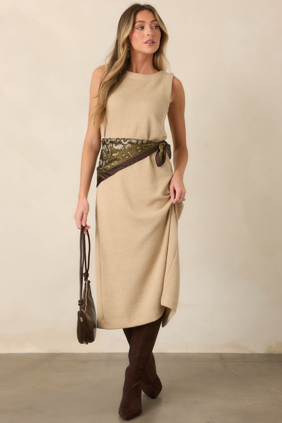 Natural rib knit midi silhouette showcasing the rounded neckline and smooth sleeveless design with understated everyday appeal.