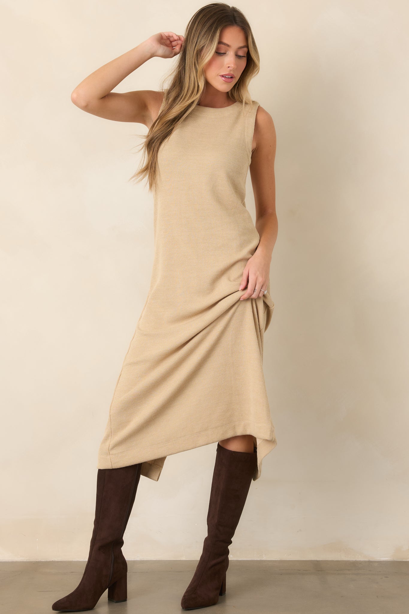 Ribbed natural midi dress defined by its rounded neckline, sleek sleeveless cut, and softly structured knit fabric.