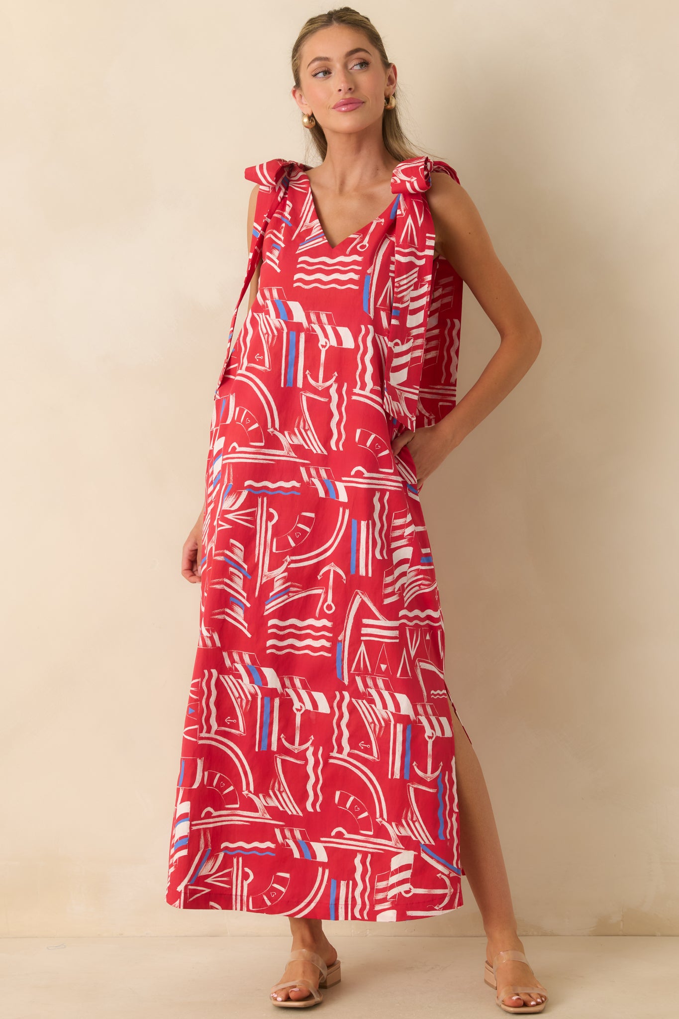 Nautical cotton maxi dress with a breezy silhouette, wide shoulder straps, side slits, and playful printed detailing.