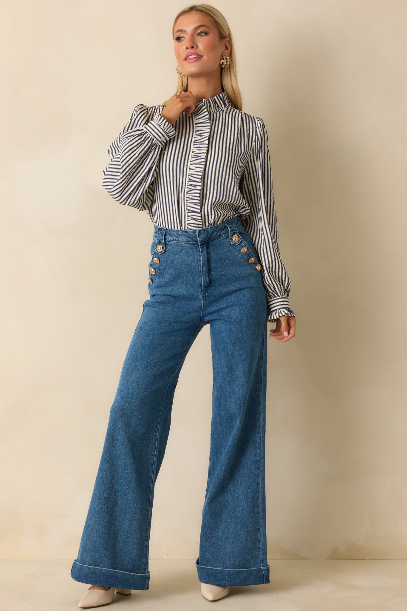 Navy blue striped blouse with a lightweight seersucker fabric and softly puckered texture.