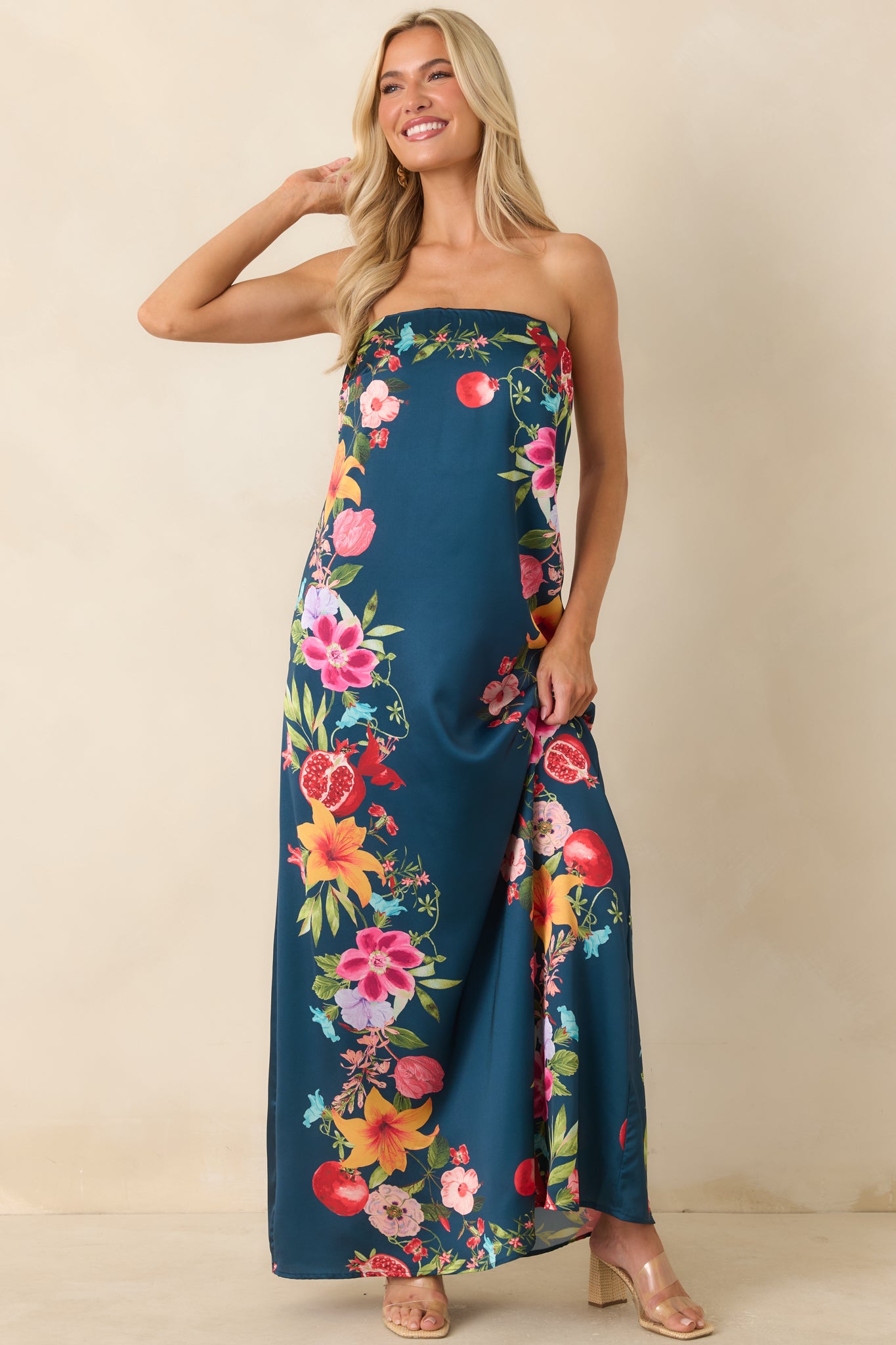 Navy floral and fruit print maxi dress featuring a smooth strapless design, elasticized top band, and lightweight flowing fit.