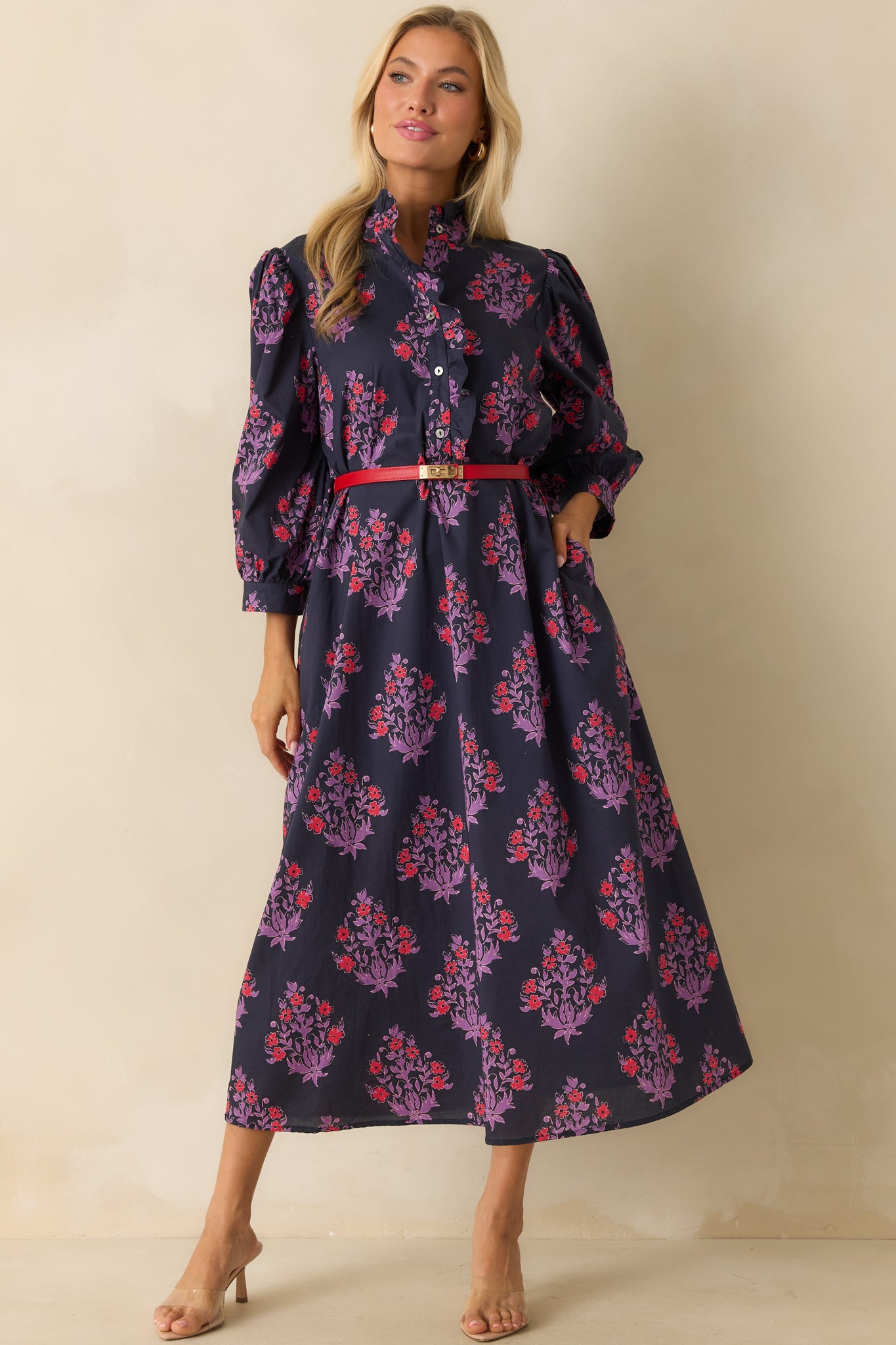 Navy floral maxi dress shown fully front-facing, emphasizing the relaxed fit and drape of the cotton fabric.