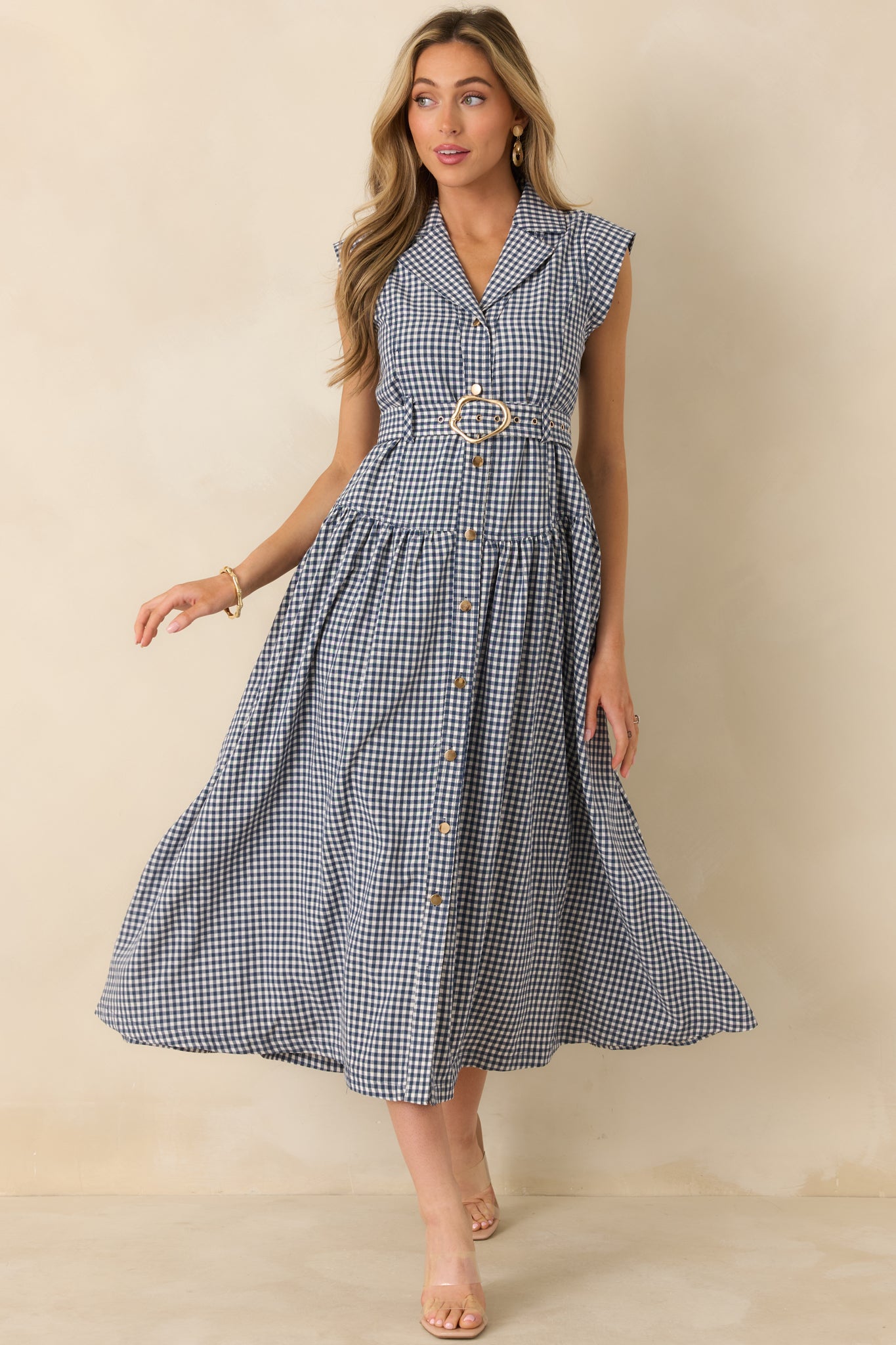 Navy gingham midi dress with a detachable belt, side seam pockets, and subtle skirt gathers for gentle movement.