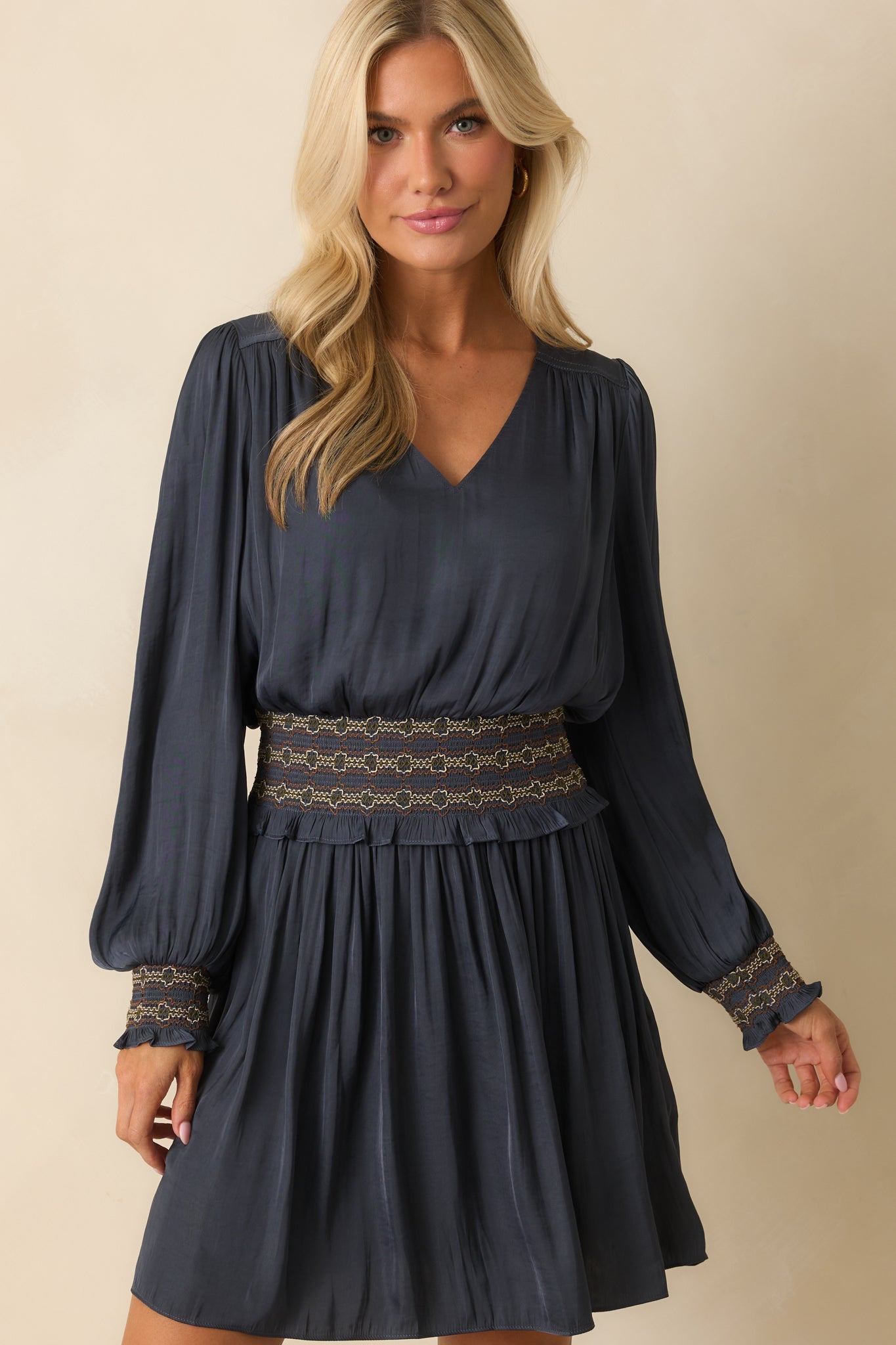 V-neckline design highlighted on the navy mini dress.