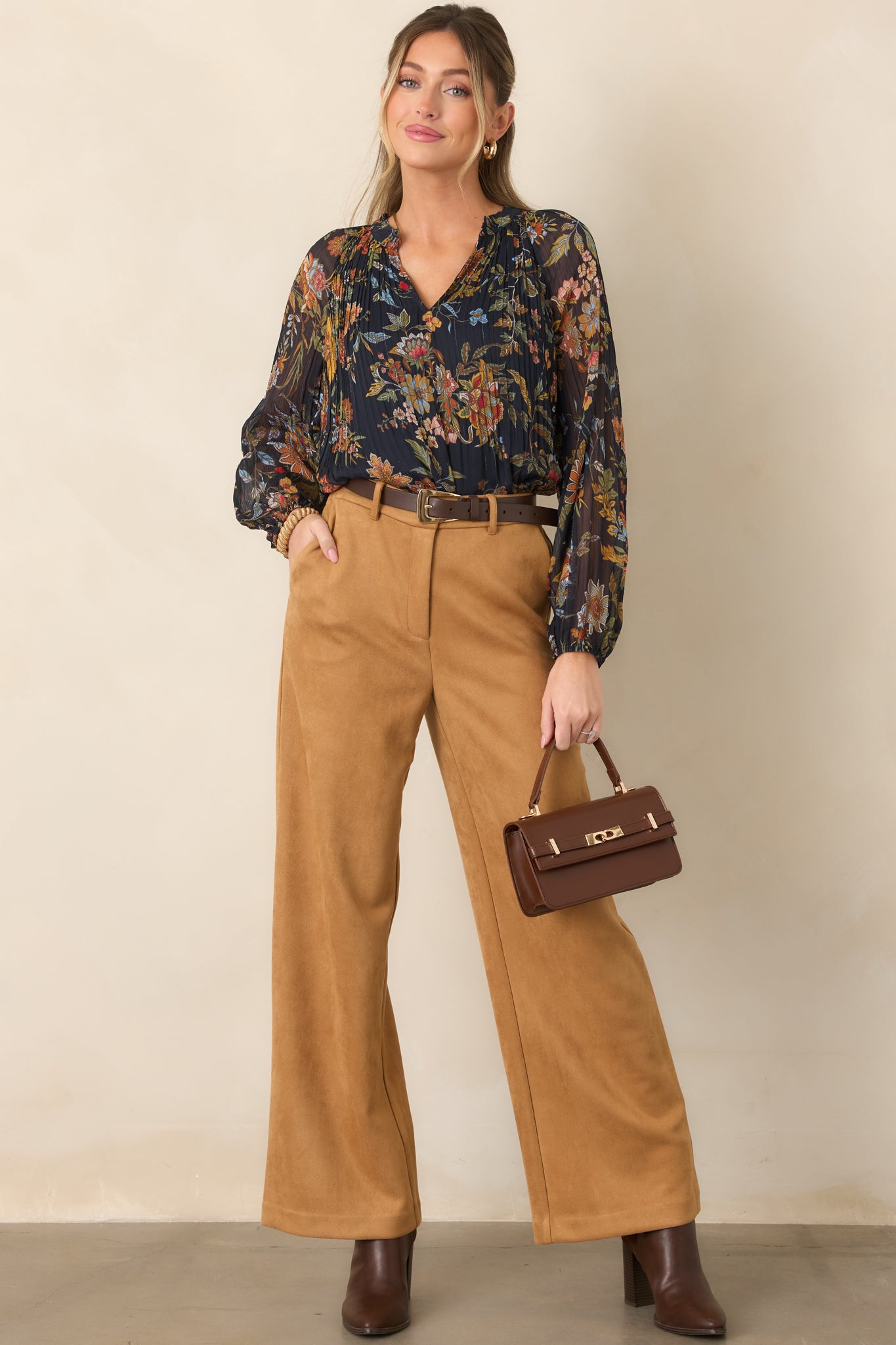 Floral botanical top showcasing warm rust, camel, pink, blue, and olive tones against a deep navy base.