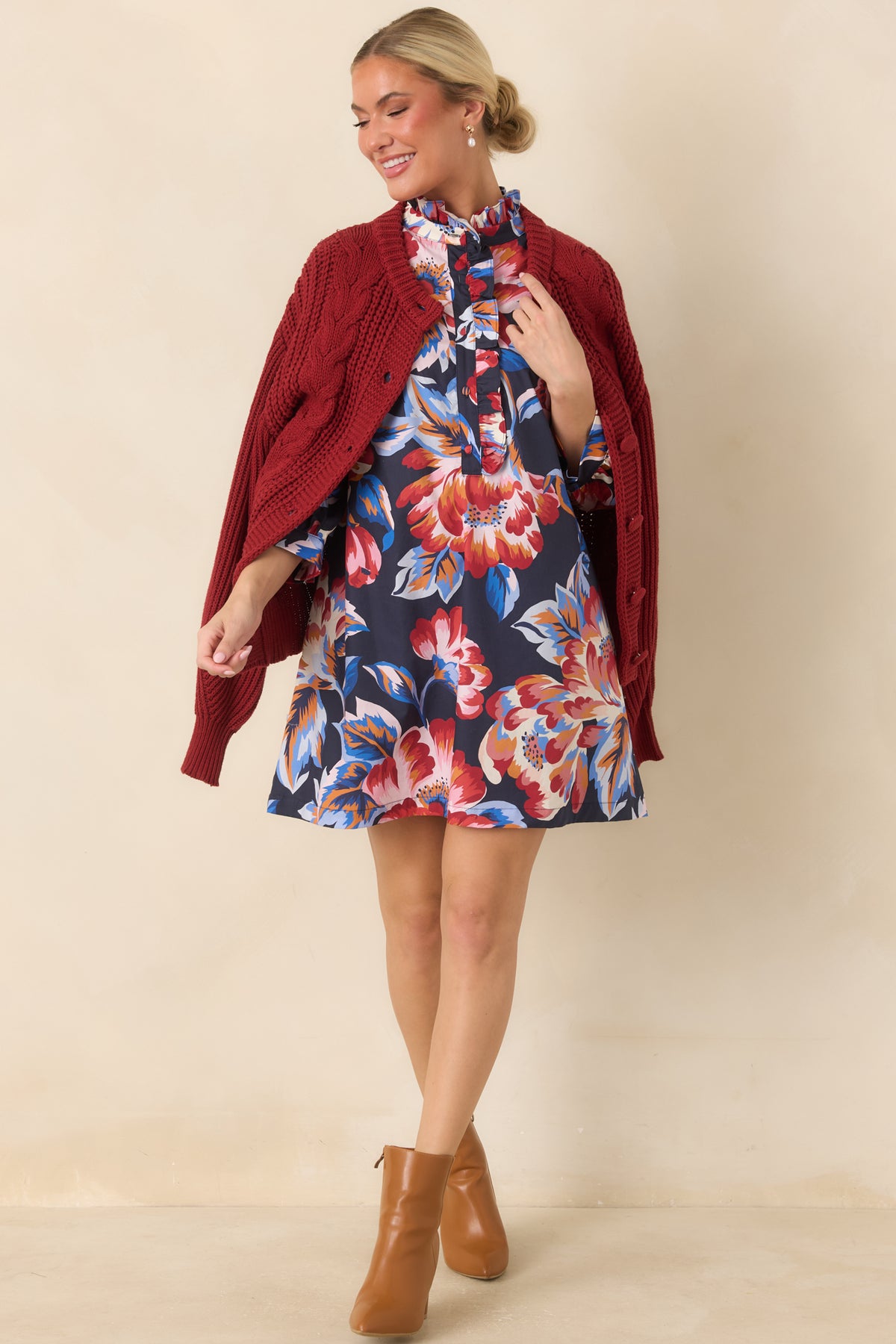 Navy multicolor floral mini dress with a relaxed, slightly flared silhouette, ruffled collar, and bold botanical print.