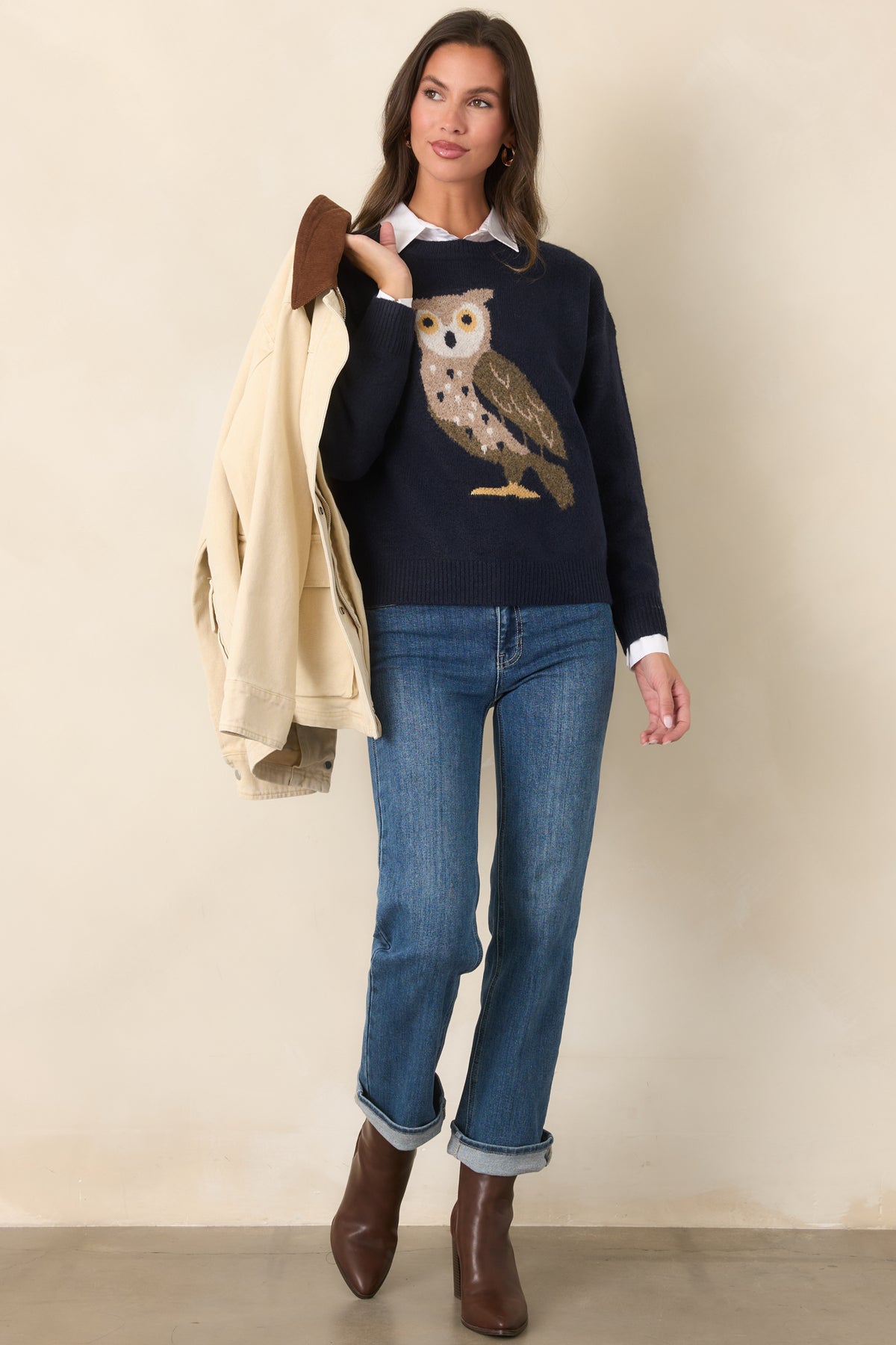 Navy sweater with a colorful front-facing owl design, dropped shoulders, and a relaxed silhouette finished with ribbed trim.