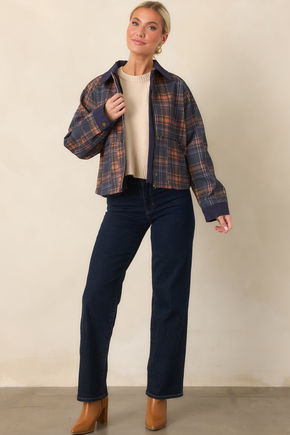 Navy-based plaid jacket with a clean zip front, snap placket, front pockets, and contrasting solid trim.