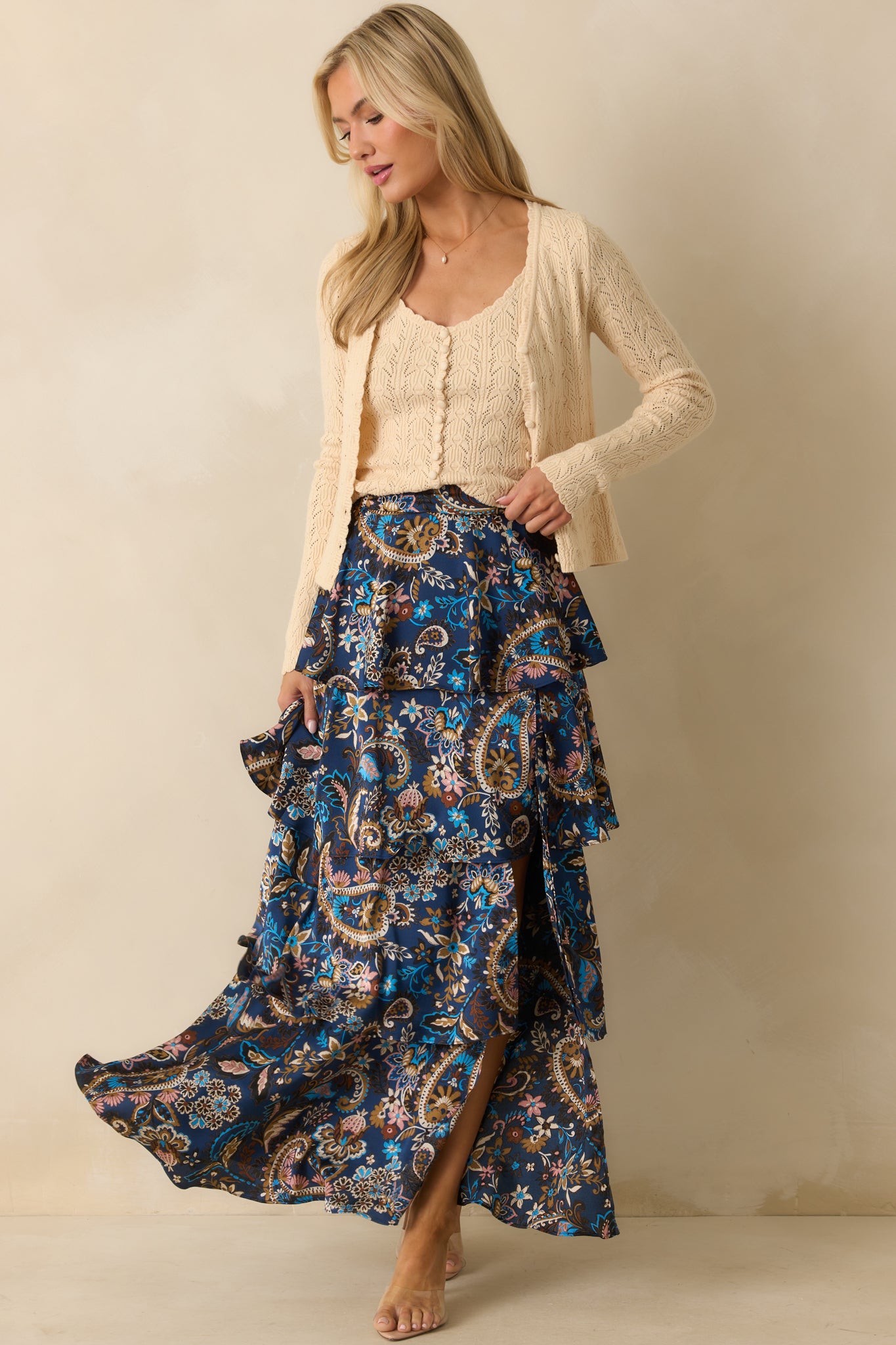 Navy skirt with back elastic waist insert and glossy satin finish.