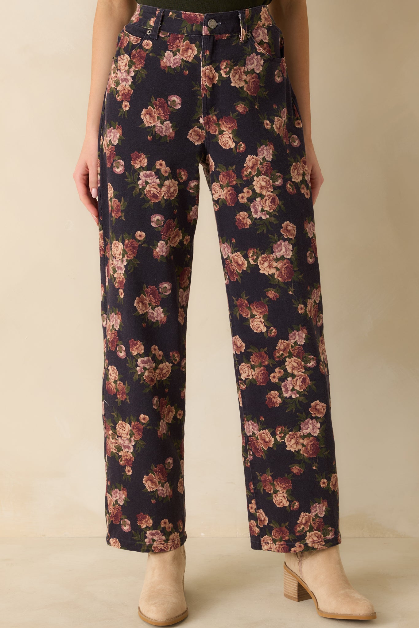 Navy straight-leg jeans with a high-rise waist and subtle allover floral print, styled for a clean, casual look.