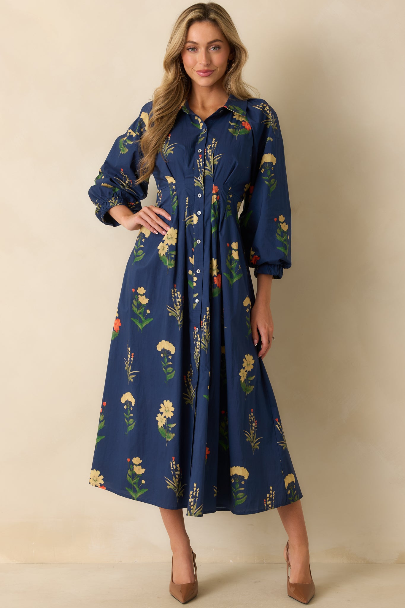 Navy woven dress showing the full floral pattern and long flowing skirt with soft drape.