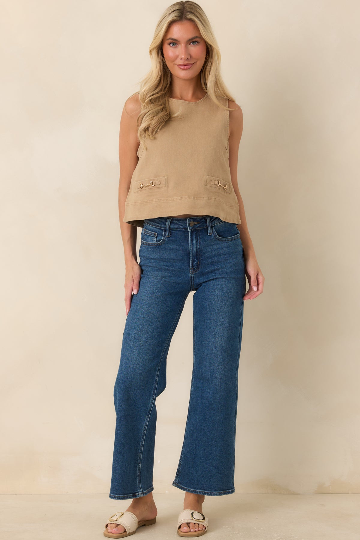 Neutral denim top with a slightly cropped fit, polished horsebit details, and a clean, modern silhouette.
