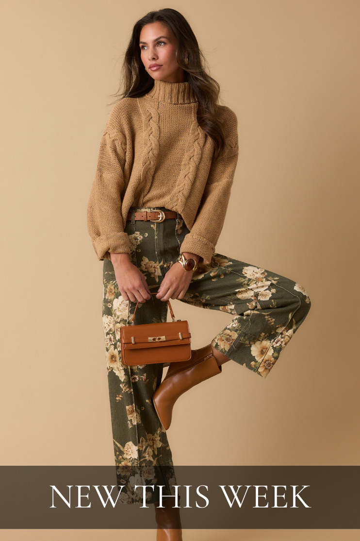 Model wearing brown knit sweater and floral pants. Text reads: "New This Week."